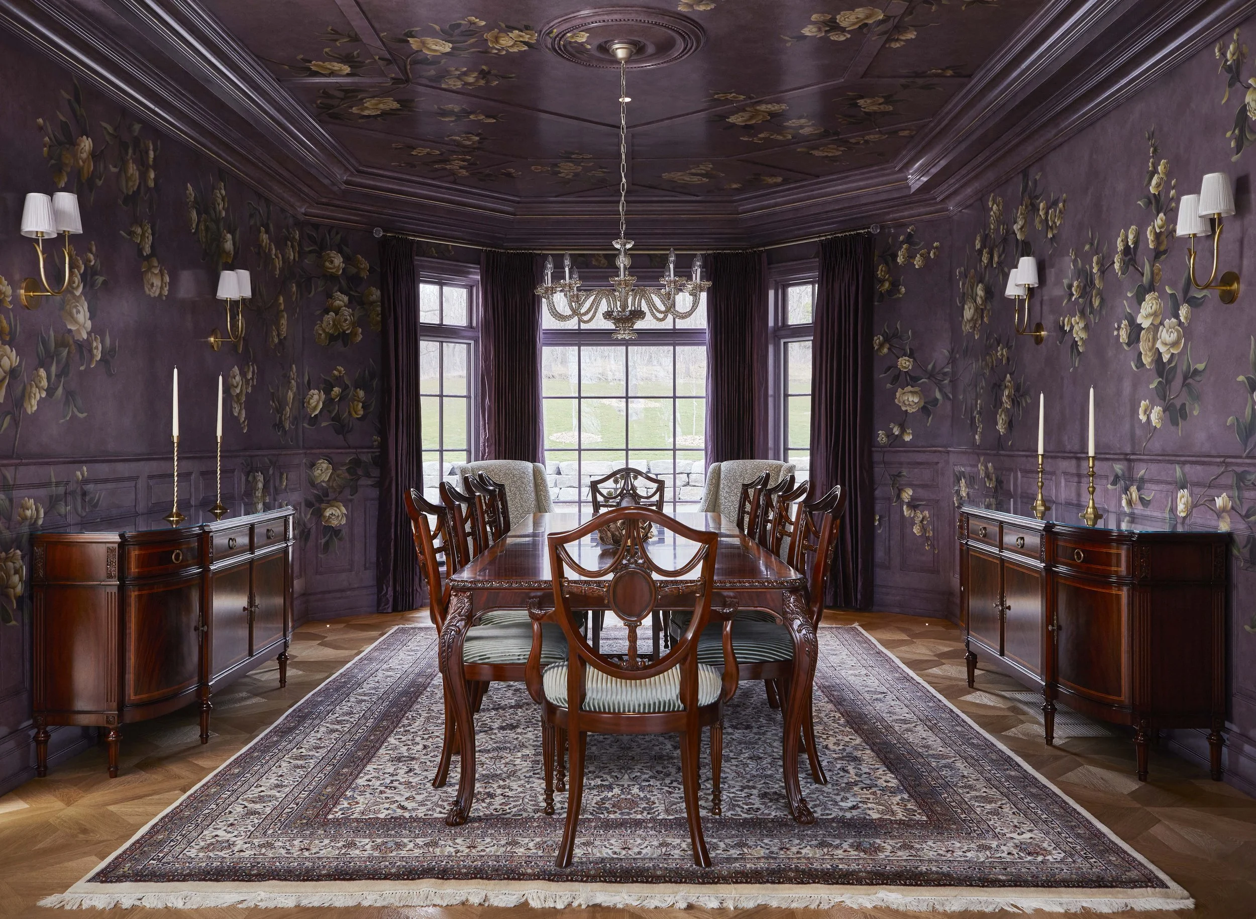  The formal dining room features a dramatic hand painted mural that wraps the entire room in colour and movement. 