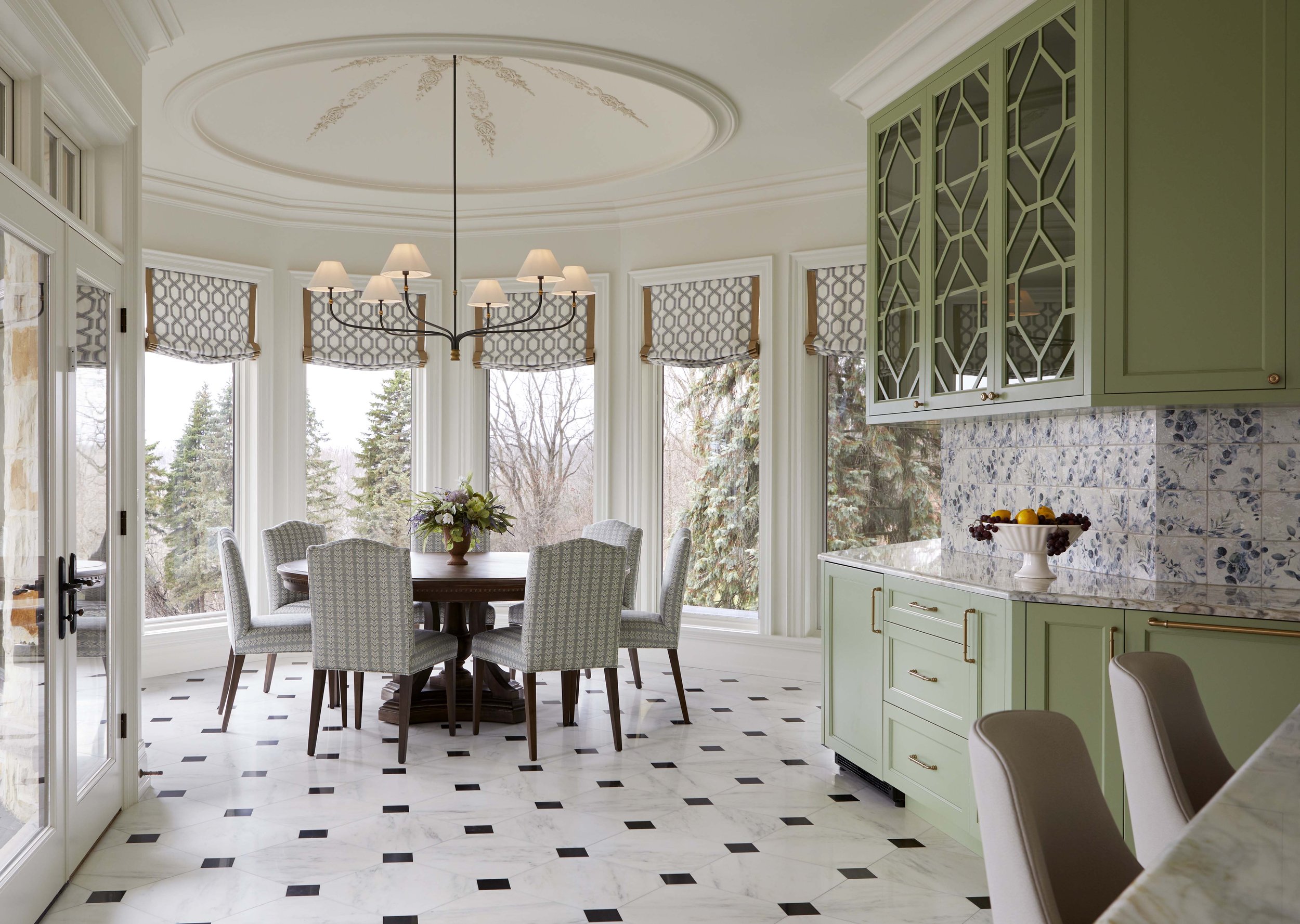  Just off the kitchen, the breakfast nook is centred under a new ornate plaster dome, with wrap around windows looking out on to the expansive view outside. 