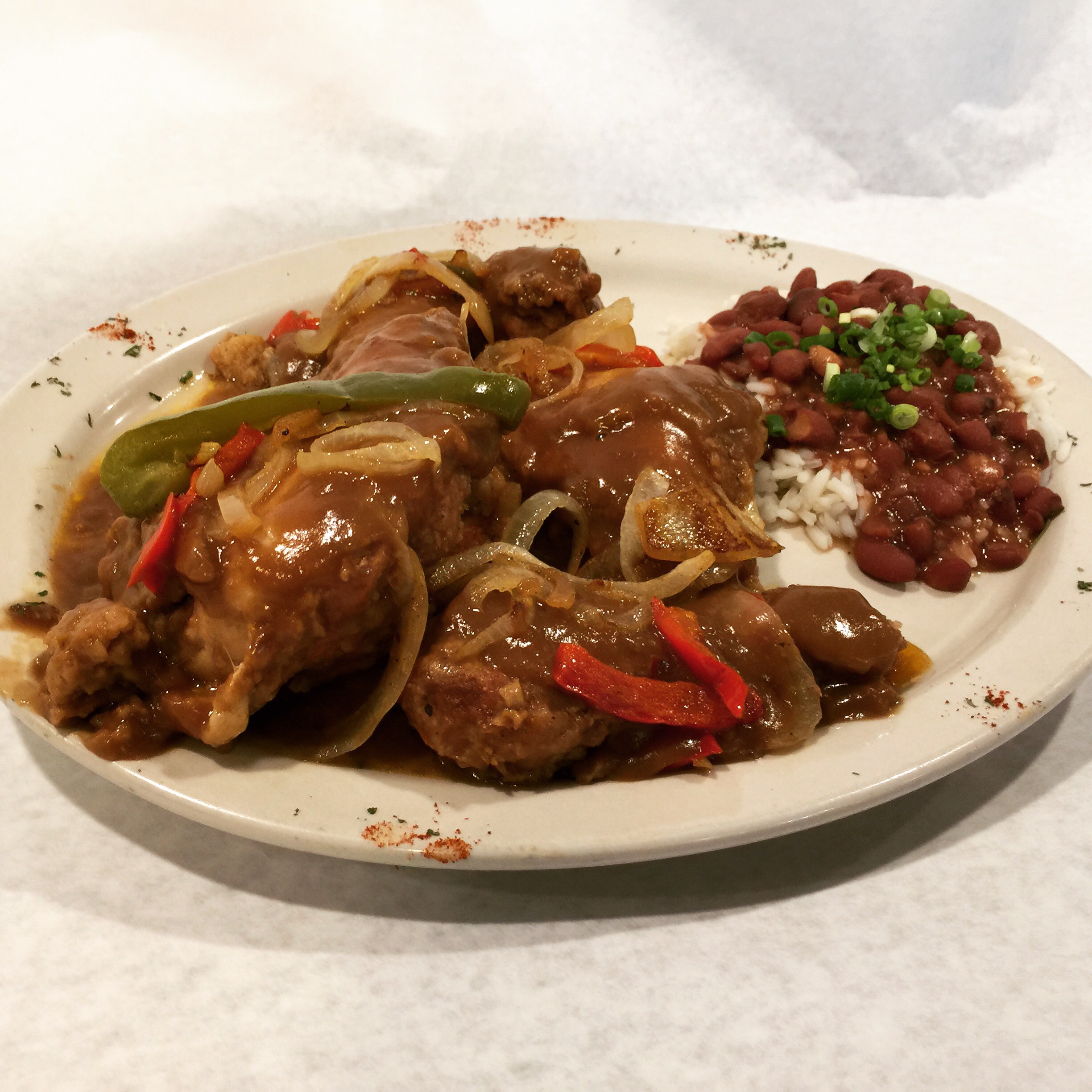 Smothered Chicken served with Red Beans & Rice