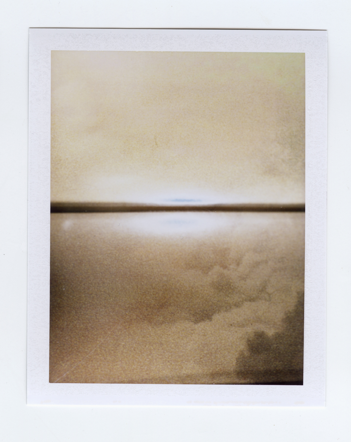   centerfold (everlasting sunset)  Polaroid of found National Geographic, 2015   Statement + Info  