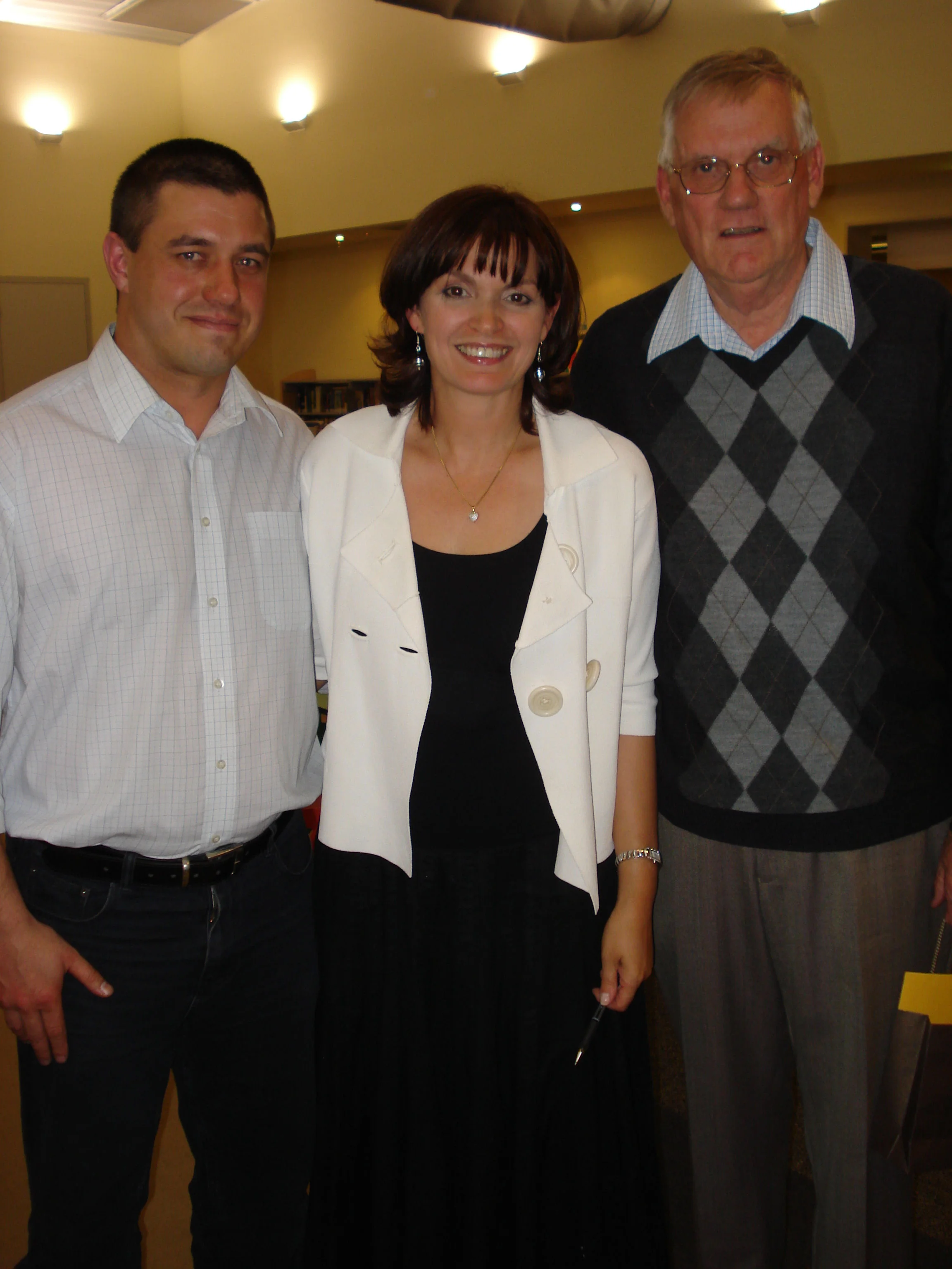 Mark Gamtcheff, second, Fiona MacIntosh, and Reece Pocock after Reece won the Burnside Library short Story Contest with his story 'The Girl in the Red Beret'. Fiona presented the prizes.