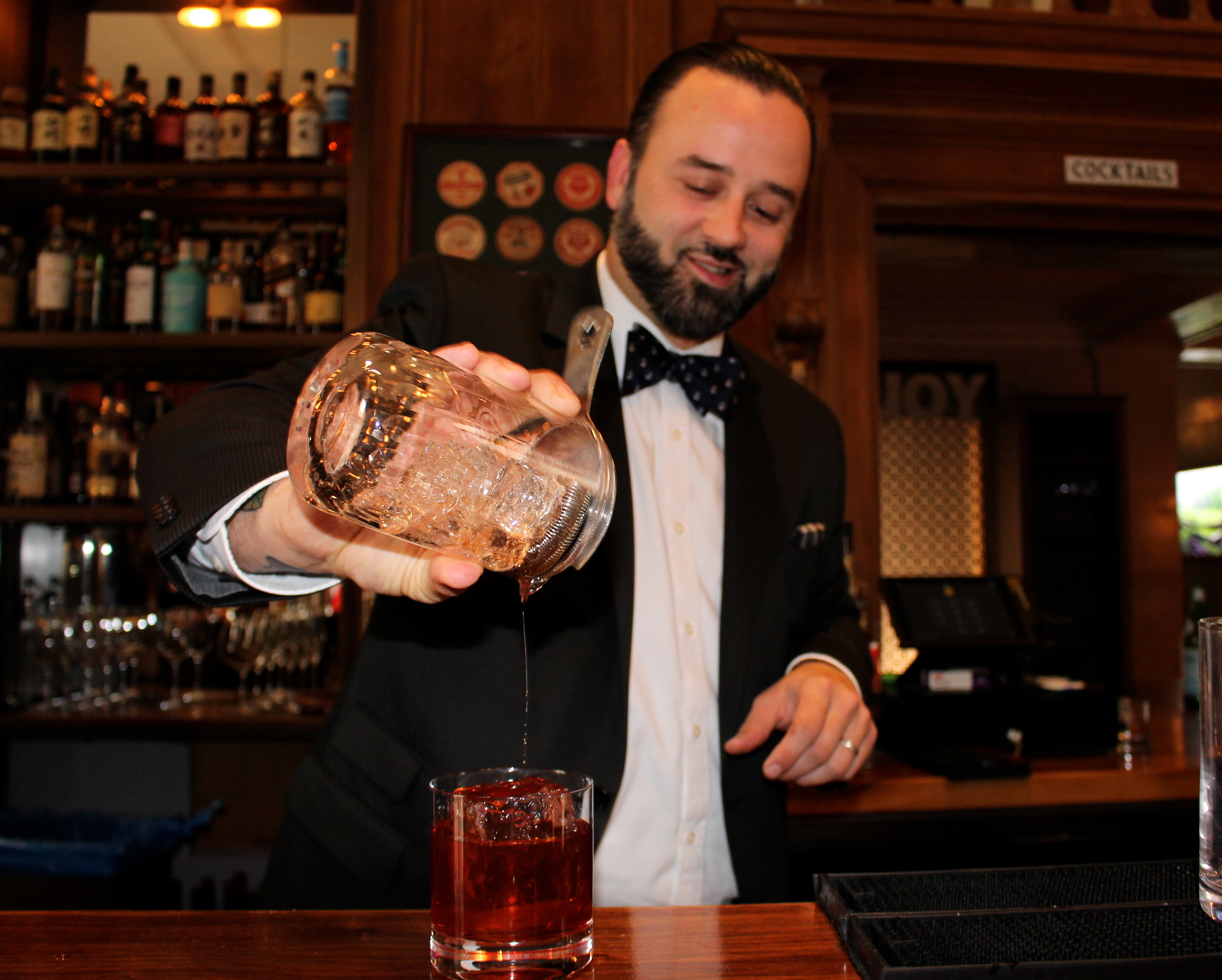 Christopher James mixing an Old Fashioned at The Vail Bar