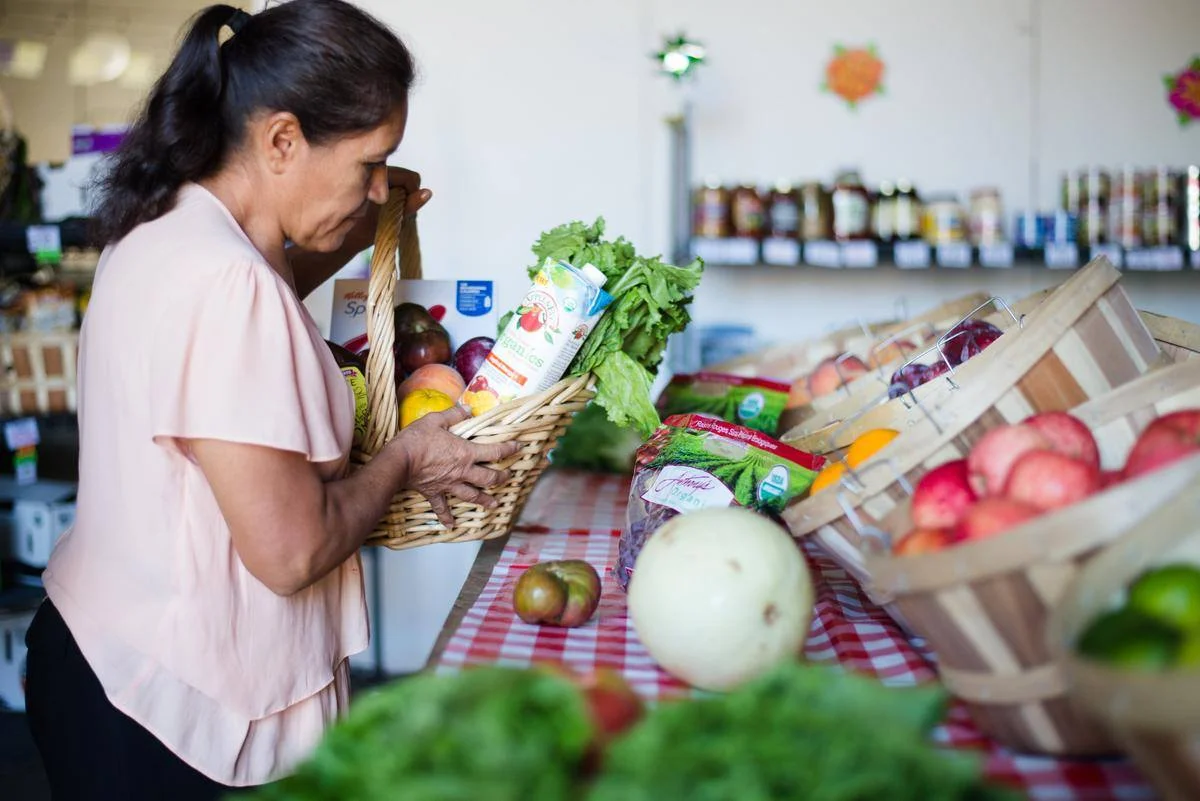 A Westwood Food Co-Op Member picking up groceries
