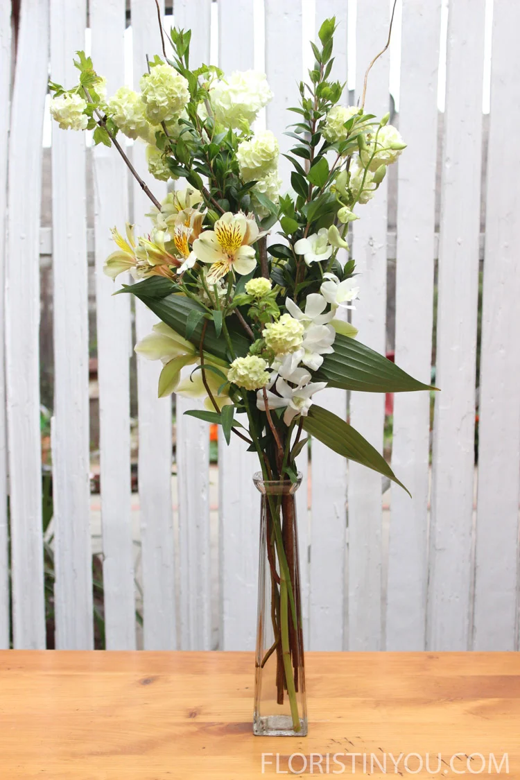 Add white dendrobium orchid to back right.