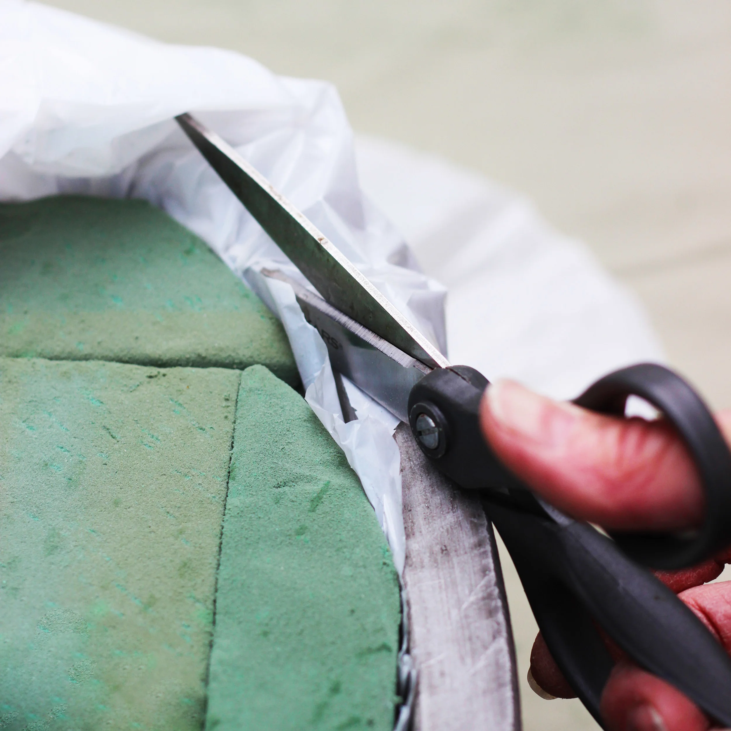 Trim off plastic as close to the foam as you can.