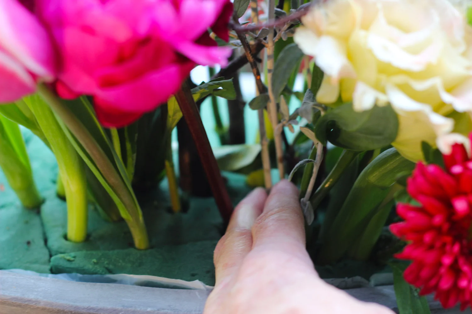 Place lavender. Use your fingers to guide the stem.