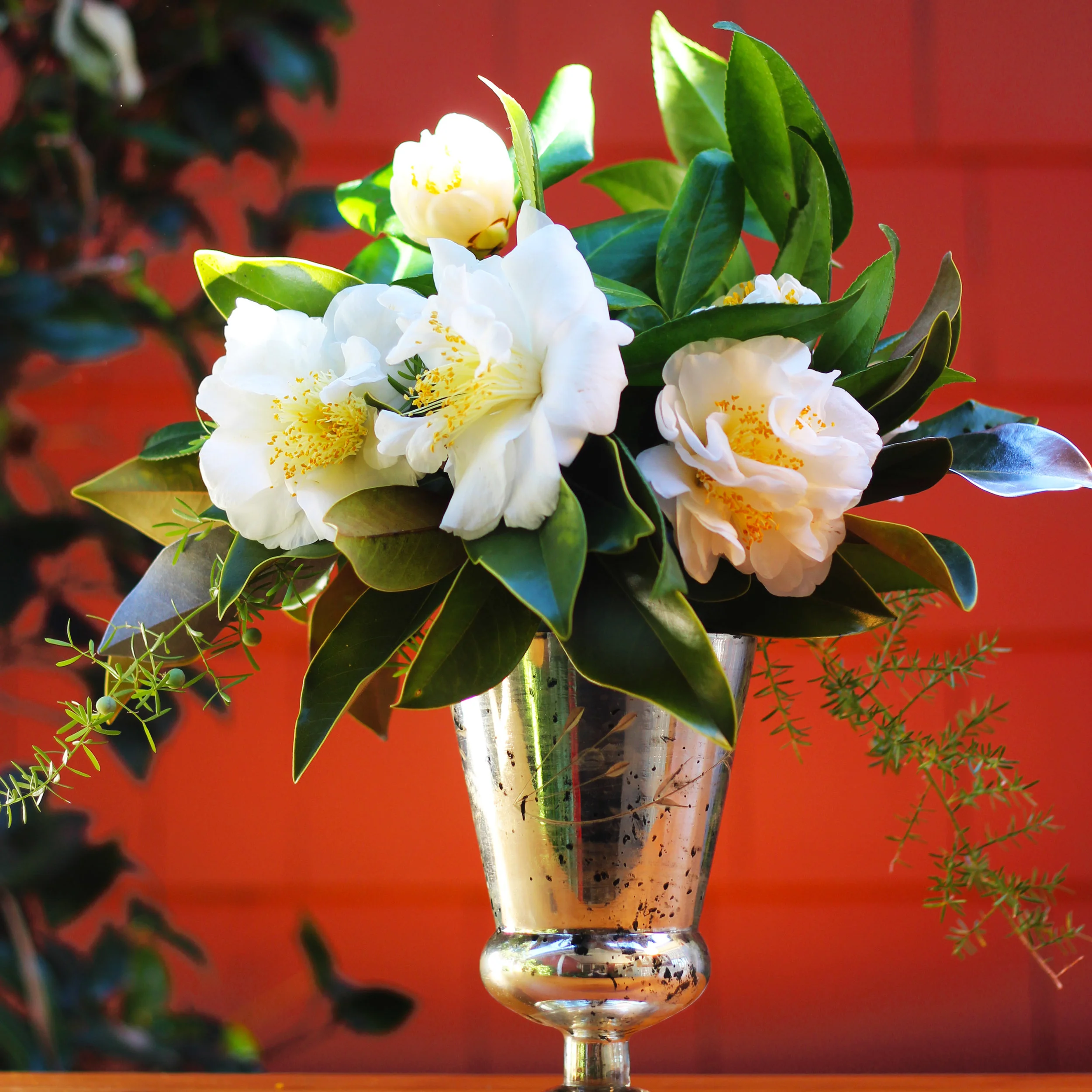 Add 2 buds left and right in the middle of the arrangement.