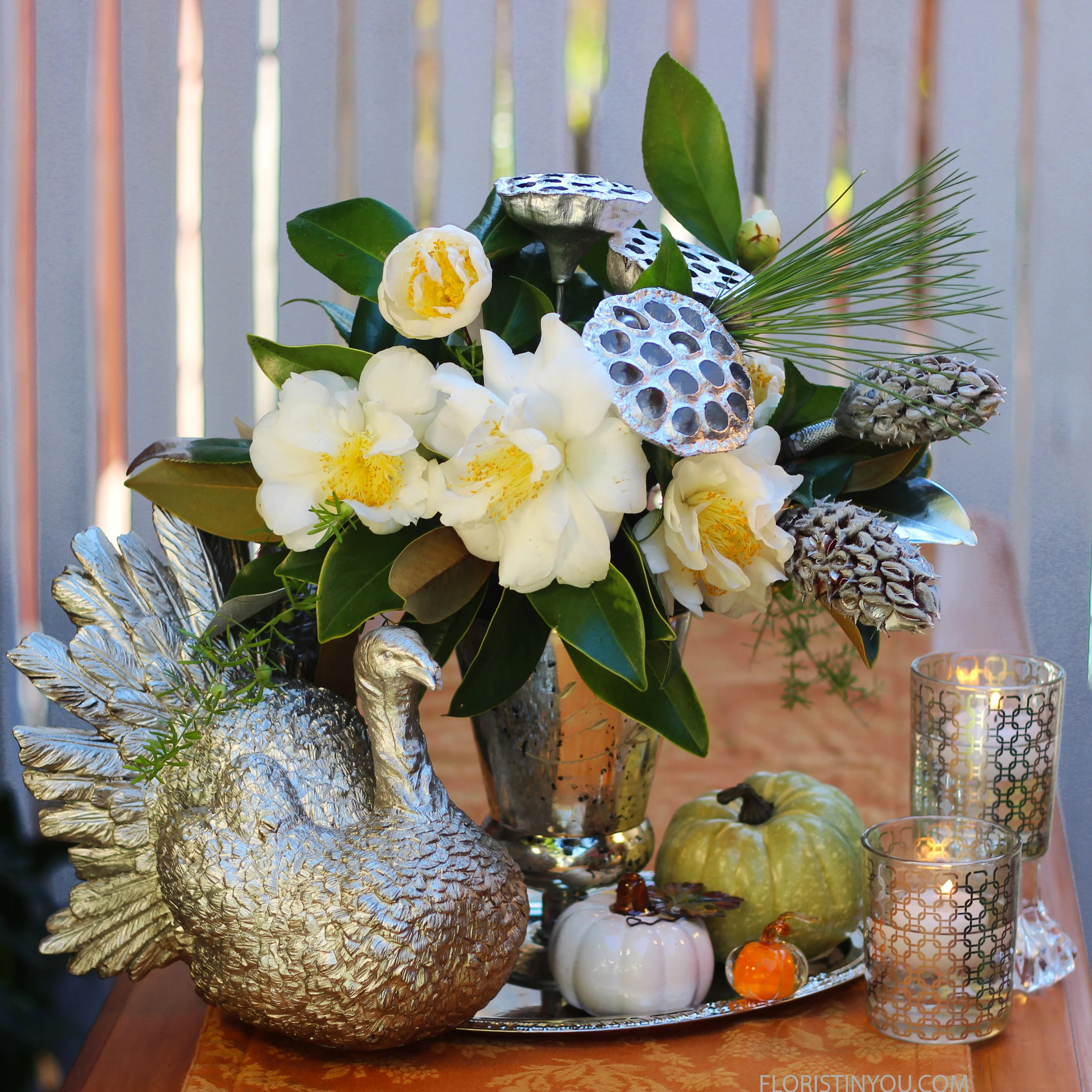 Add your silver turkey, pumpkins, tray, and silver patterned votives for your table setting.