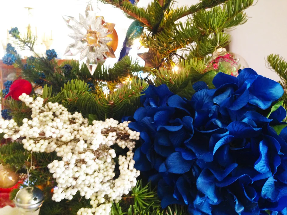 Add the white berries and faux blue raspberries.