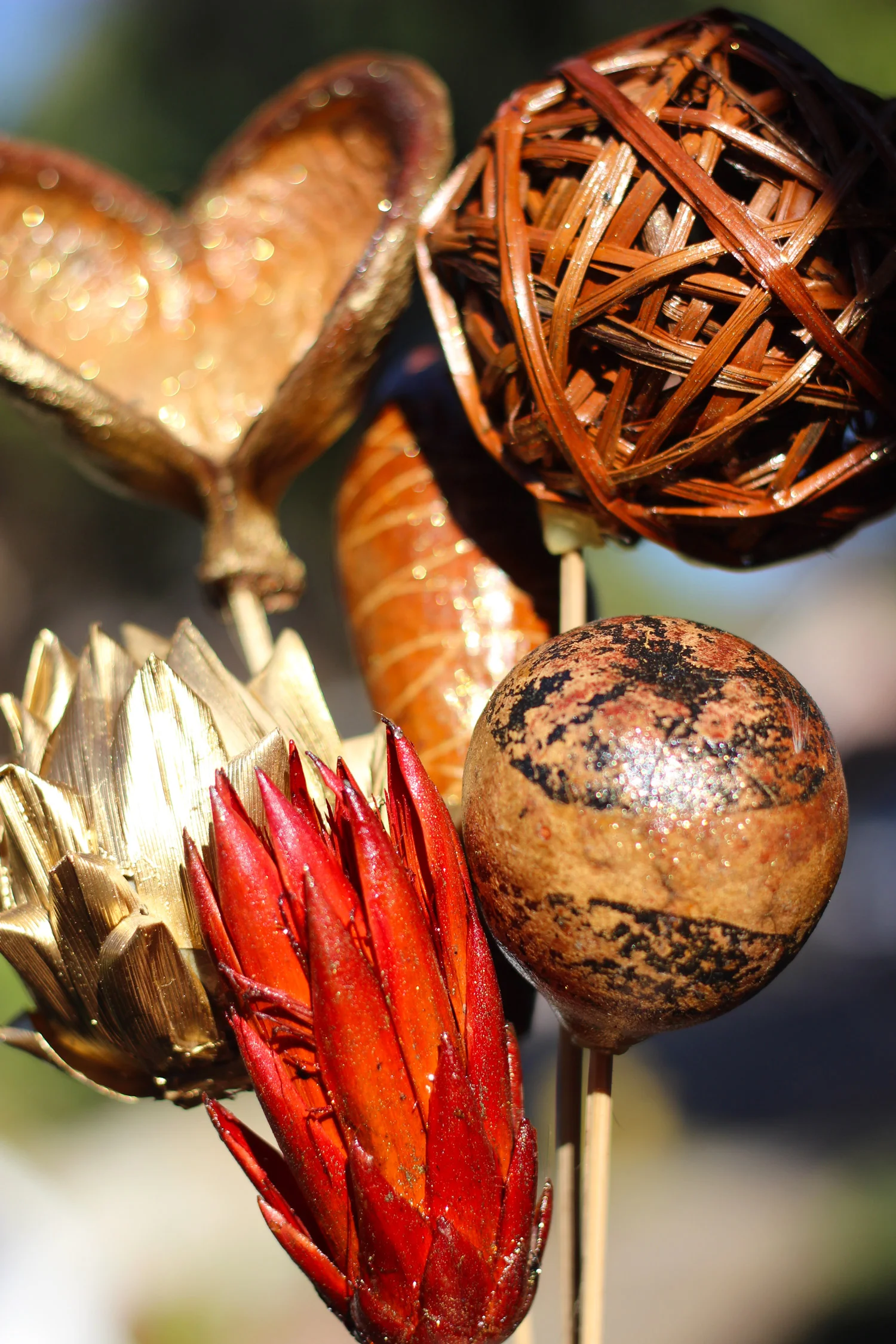Spray those pods with color or designs with gold glitter spray.  Spray the rest metallic gold.