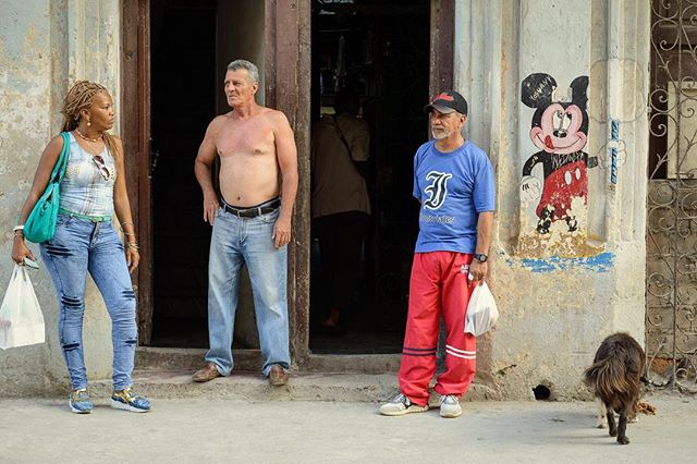 Even Mickey Mouse makes an appearance on the bustling streets of Centro Habana. #cubanlife #goinghome #streetphotography #centrohabana #cuba #havana #mickeymouse #shootingthebreeze