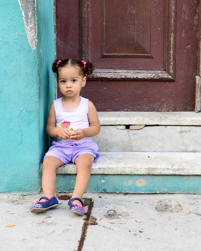 Another young, innocent face. #cubanlife #cubanchildren #centrohabana #streetphotography #havana #joyful #goinghome #cuba #frontstoop