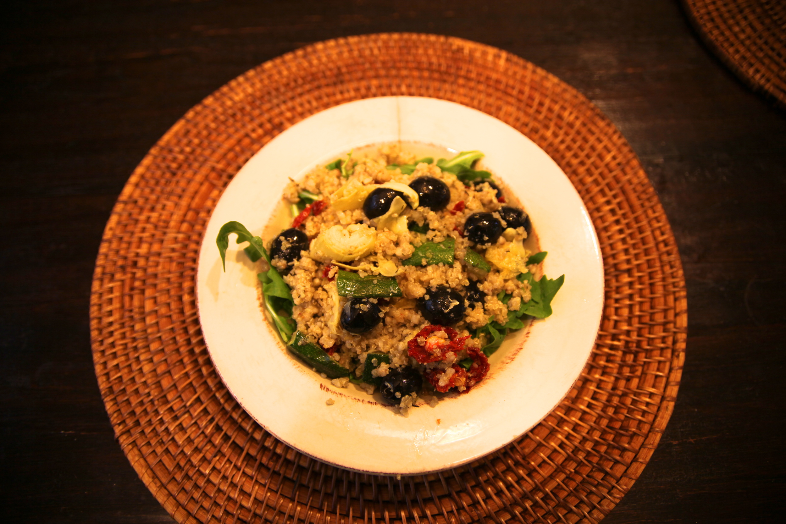 Quinoa with roasted artichokes, zucchini, sundried tomatoes and olives