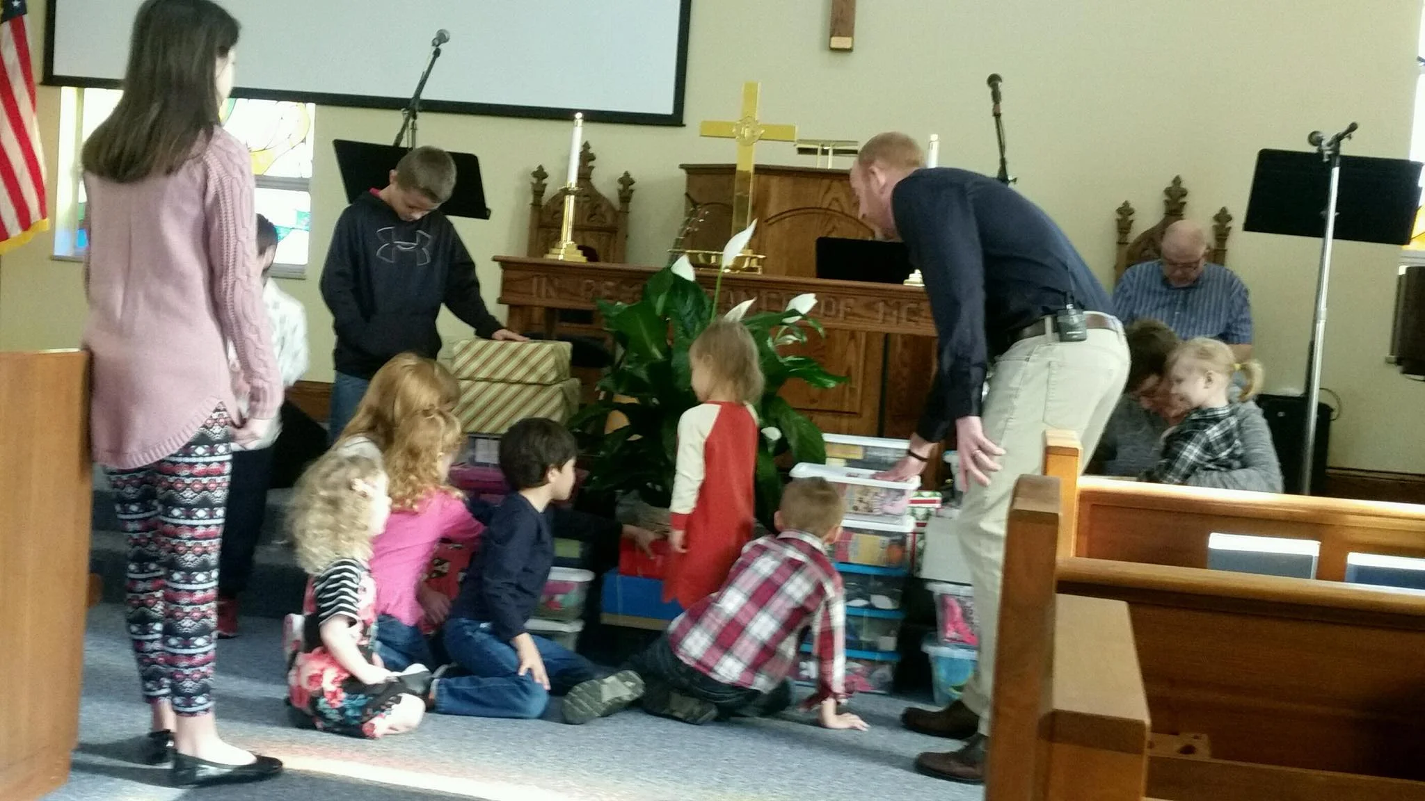 Praying over the Operation Christmas Child boxes on November 18, 2018.