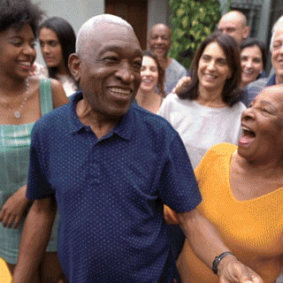 A group of diverse people smiling and laughing outdoors, engaging in a joyful gathering. sample of animated video for canada life