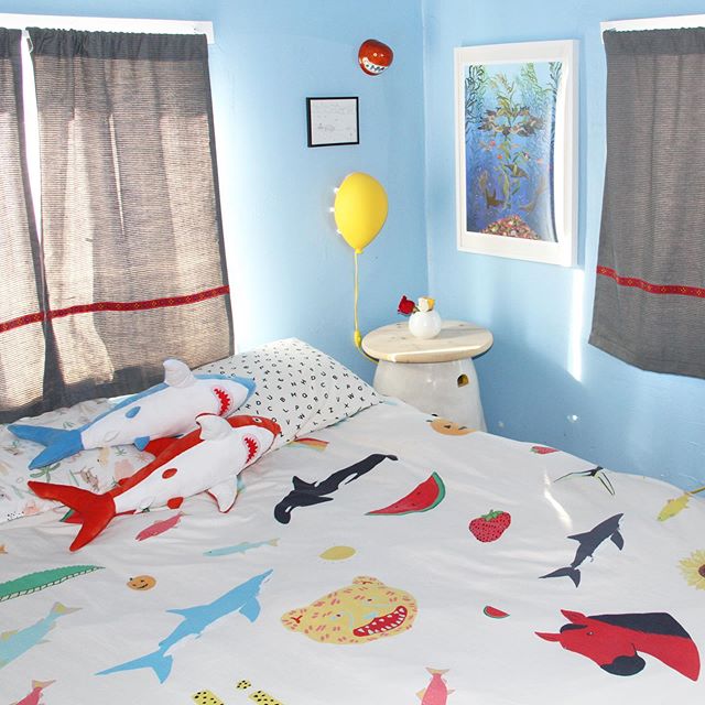 My bedroom 😴! Yellow, Black, and Blue stuffed sharks in my shop (link in bio). Duvet covers and more on my @society6 society6.com/lorienstern 🛏 🦈 🎈