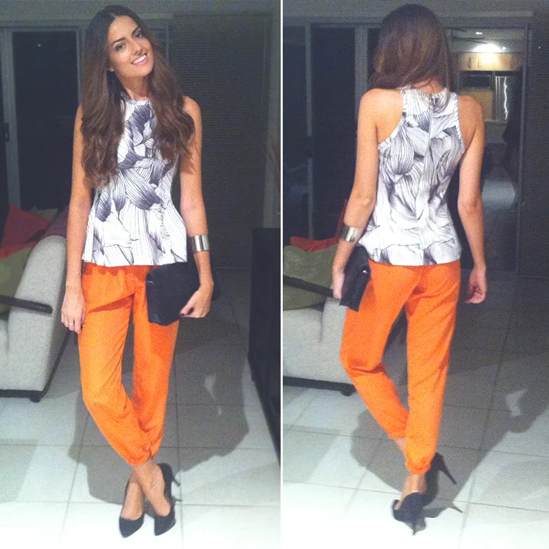 Last Thursday night I headed to the QT Fashion Week & Awards to see the Talulah SS13/14 & Minty Meets Munt SS13/14 shows with friends and colleges Cara & Amy from Anna & Ruth Boutique & to watch some friends walking in the shows. I loved Talulah's collection, the colours and angular cuts were beautiful & the soft pastel tones really stood out to me. Minty Meets Munt had a fun, fresh & 90's feel to it with palm trees and pops of bright blues, greens & yellows! Oh and the music for the shows was perfect.. it had a fun upbeat feel which suited both collections. I was in a bright mood so opted for my ASOS tailored pants with By Johnny's Petal Knit flair top and my oh so comfy Therapy pointed heels. - Top | By Johnny Pants | ASOS.com Cuff | Sportsgirl Bag | Vintage Shoes | Therapy