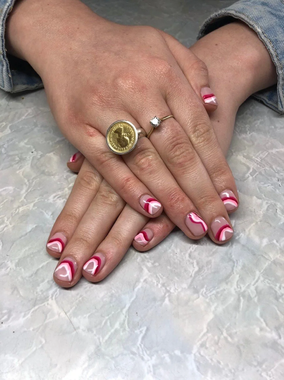 Red and white swirls nail art