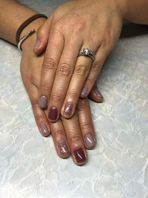 short square nails painted with neutral colours