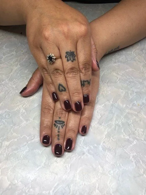Short natural nails painted rich brown 