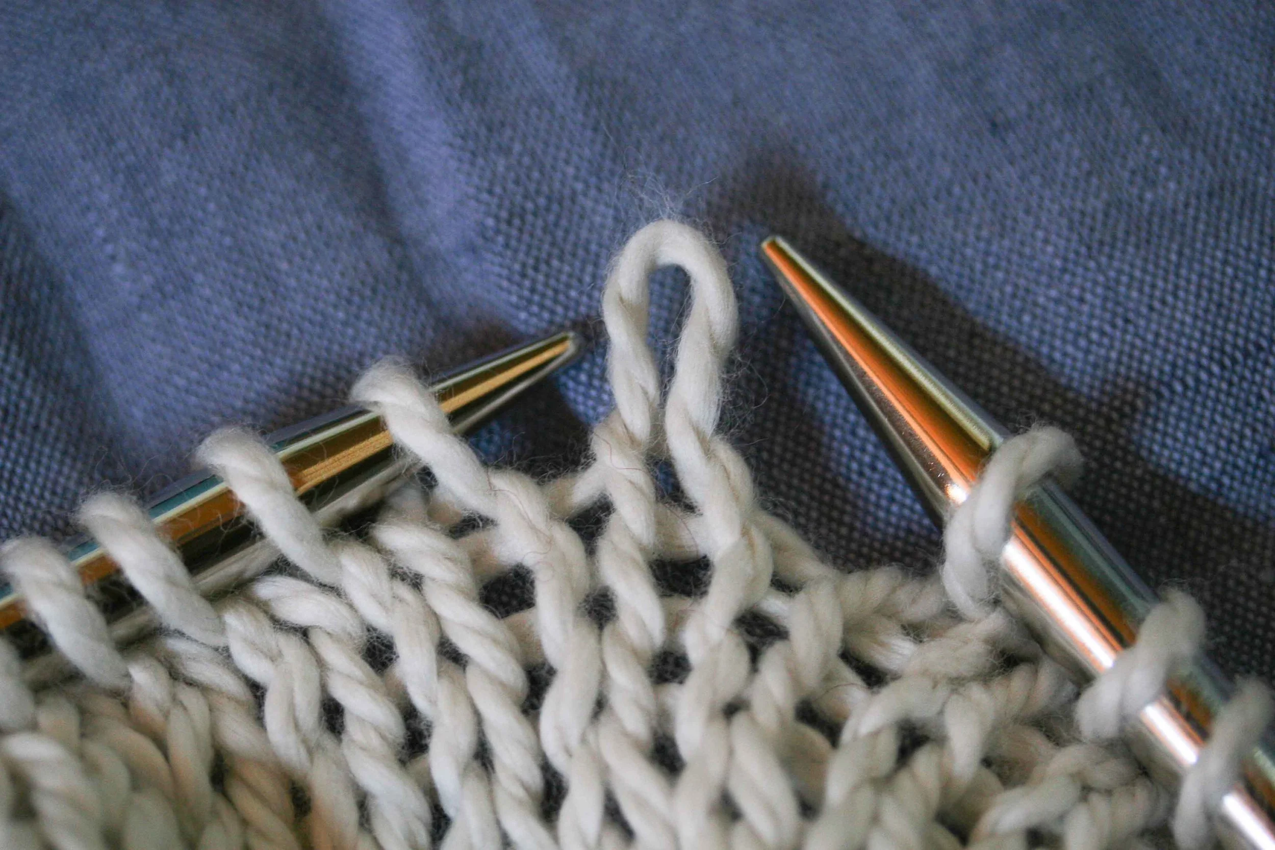 A loop pulled through a loop pulled through a loop. The loop shown is a knit stitch BECAUSE it was pulled from the back through to the front - see how it pokes forward/up.