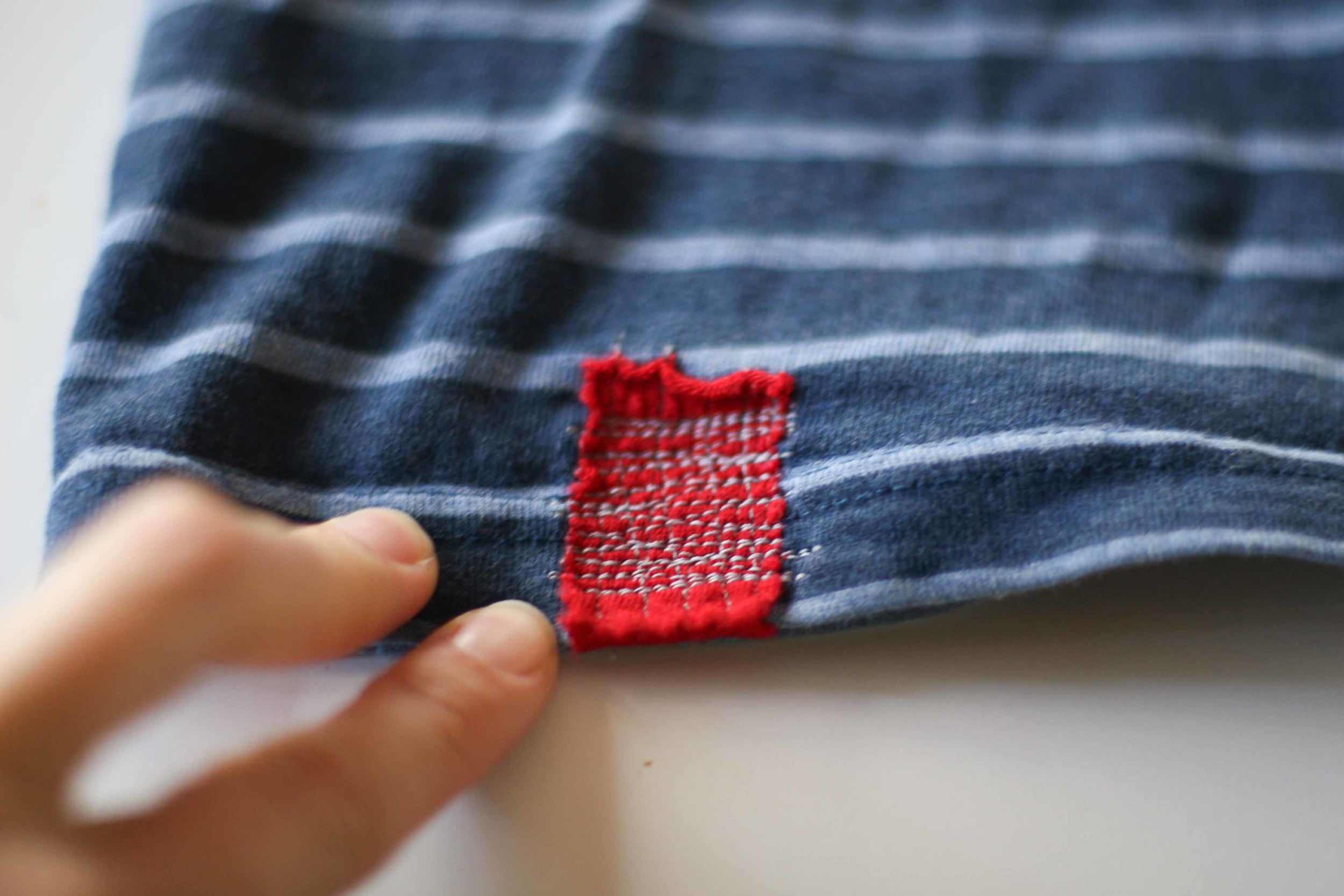 The simple visible mending with slow stitching 