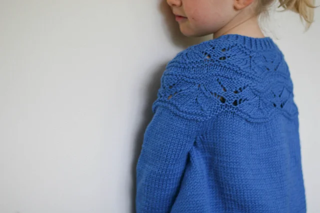 Baby Sibella as a cardy.- photo and knitting by Felicia Semple