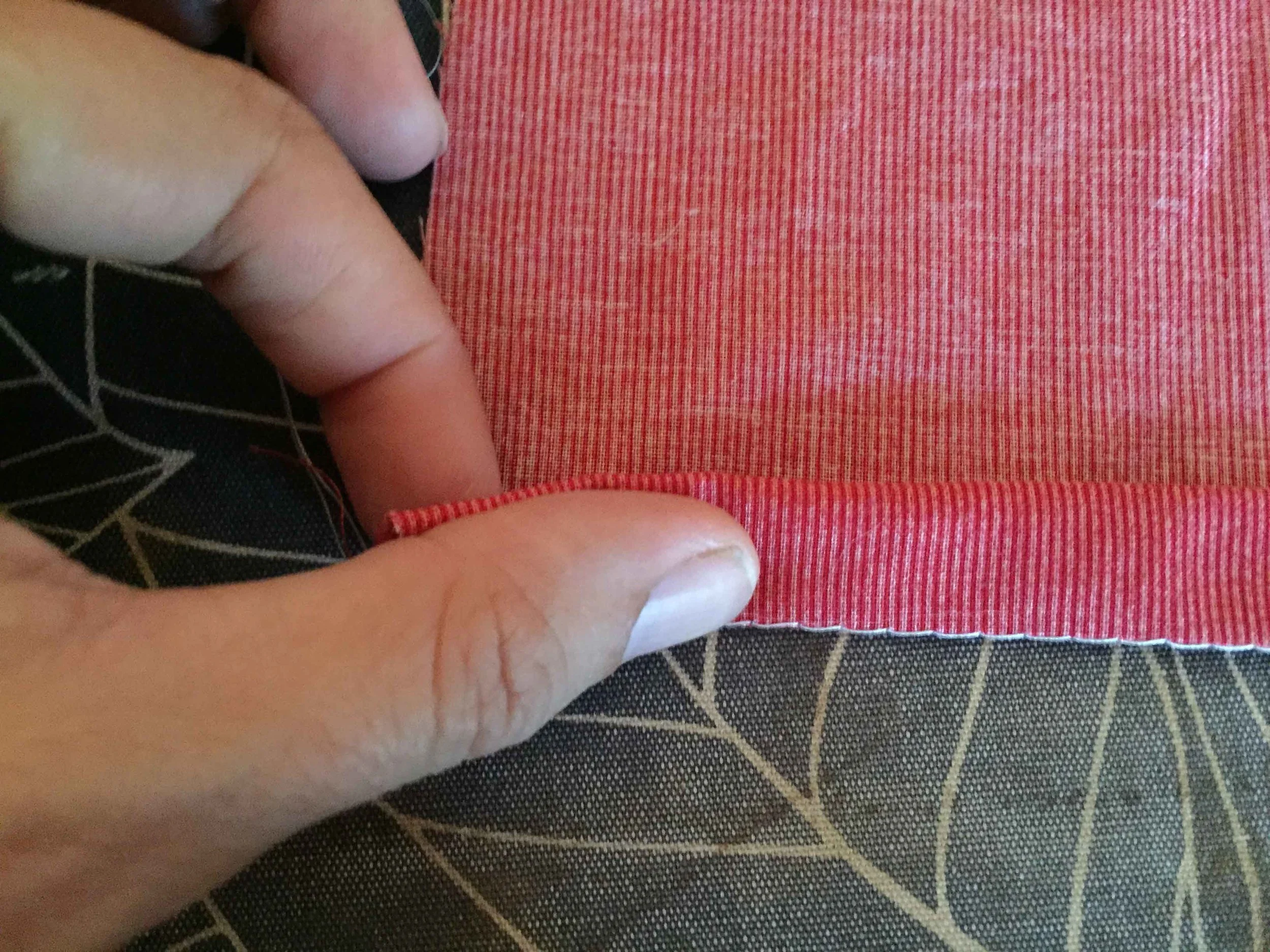 After pinching it together I slide my pointer along my thumb to fold as much of the fabric as I can with one sweep - this is tricky to explain. Give it a go.