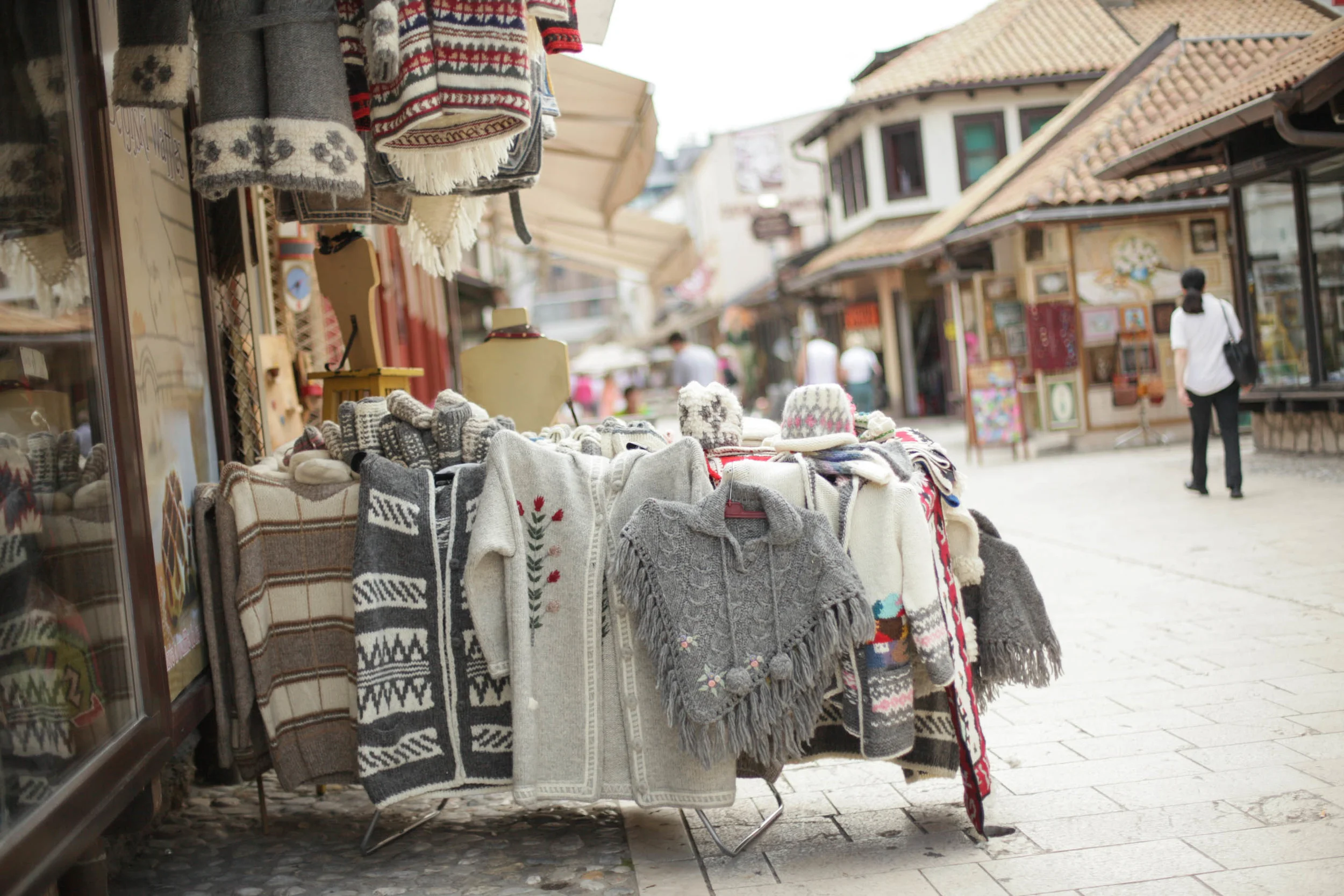 Common street stall of hand knits. Worsted weight, with embroidery over the top. The patterns were a total mix of styles but had a lot of natural colours. The colour was added as small bands of colourwork or embroidery.