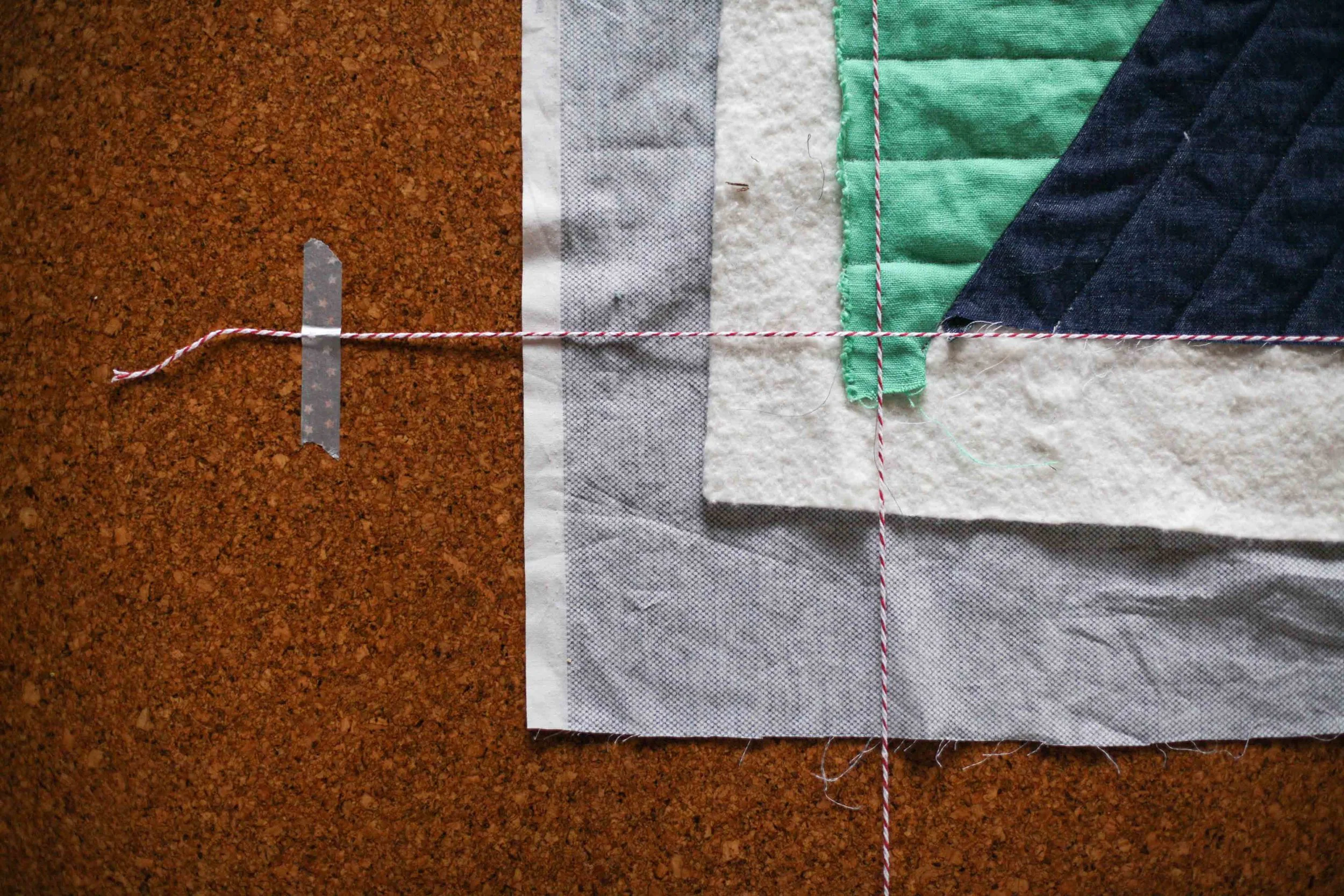 Getting the quilt ready to trim the binding.
