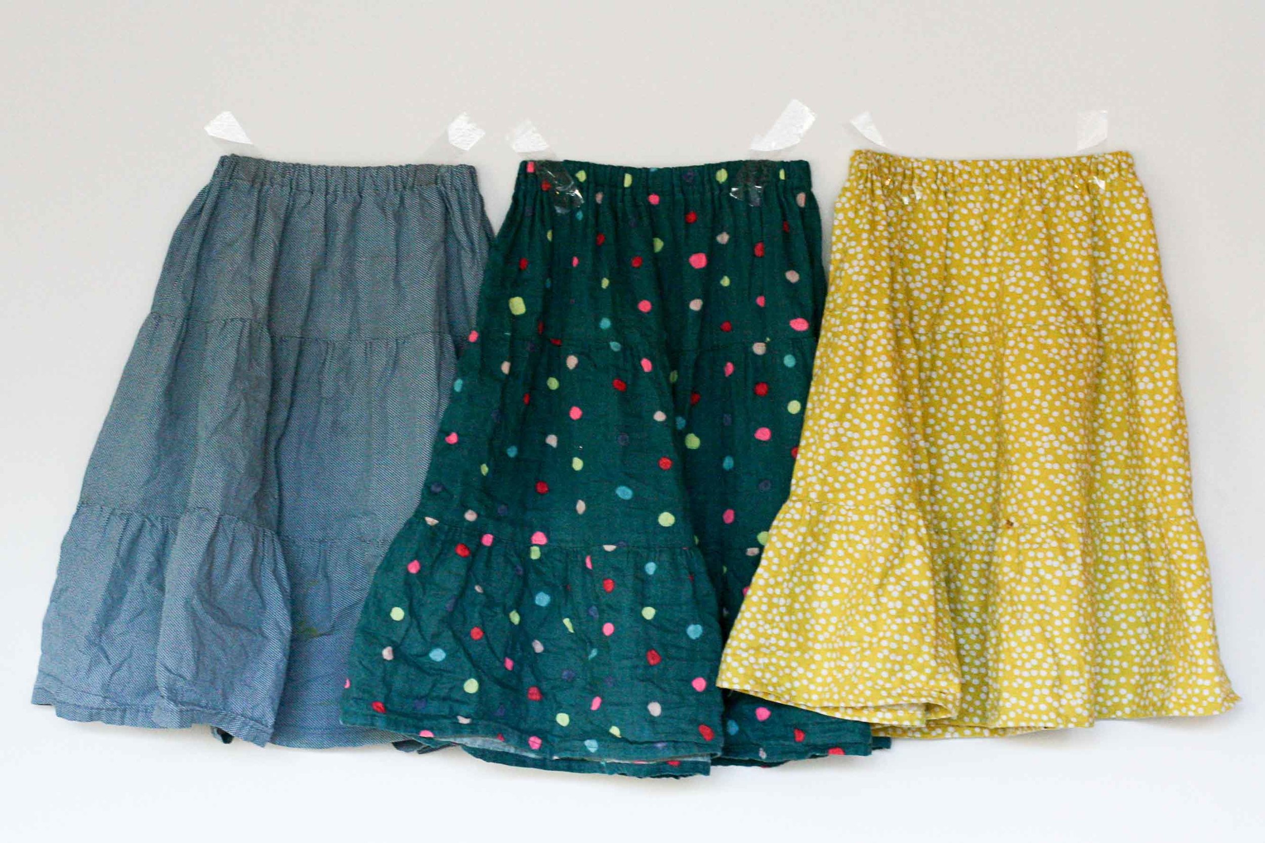 All three skirts were made at once with dirty blue grey cotton. Obviously not the ideal choice for the yellow spot skirt, but after over two years of wear I've never had anyone look inside the garment and be appalled by my cotton colour choice. It meant I could make all three at once, chain piecing, which is infinitely faster than making things one at a time. I changed the top thread only to topstitch the waistband and the hem of the yellow skirt. Works a treat.