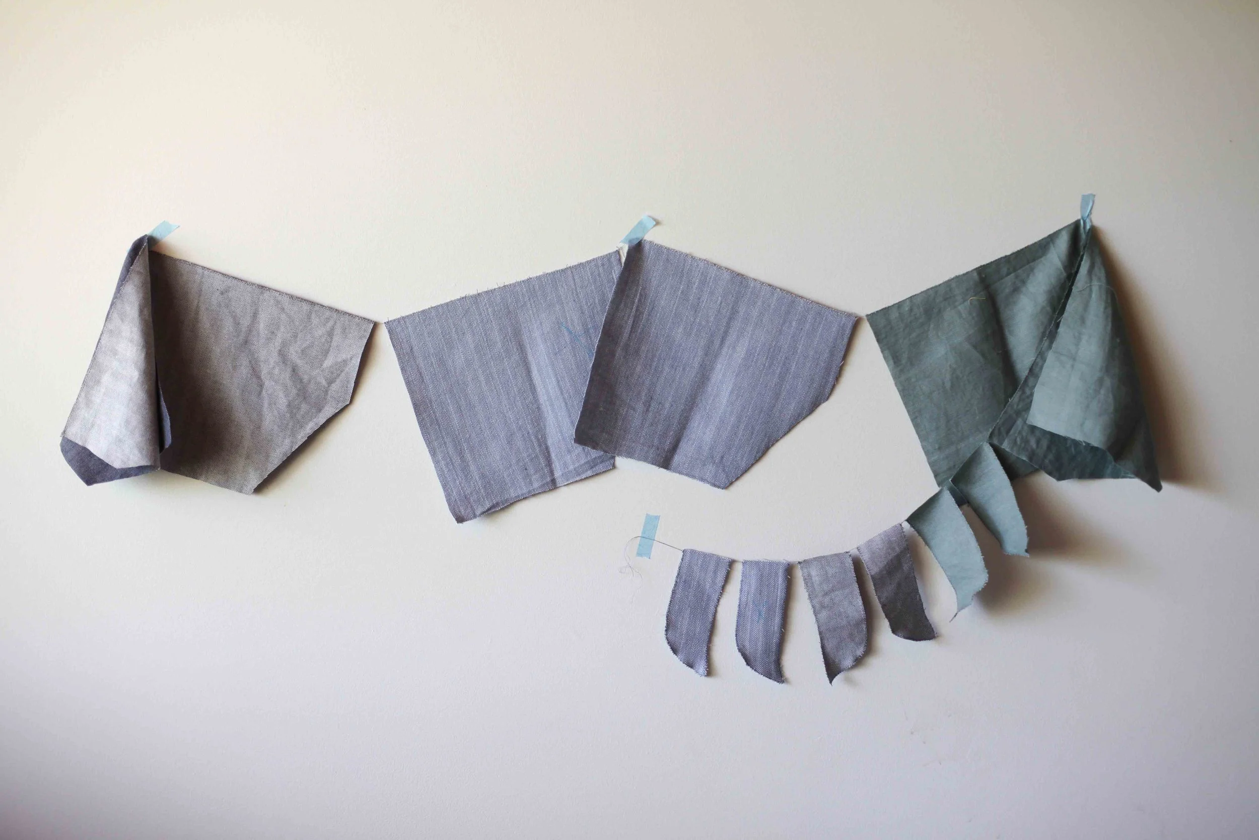 This is six pockets and six fly pieces all chainstitches together using dirty grey cotton for three different pairs of shorts.