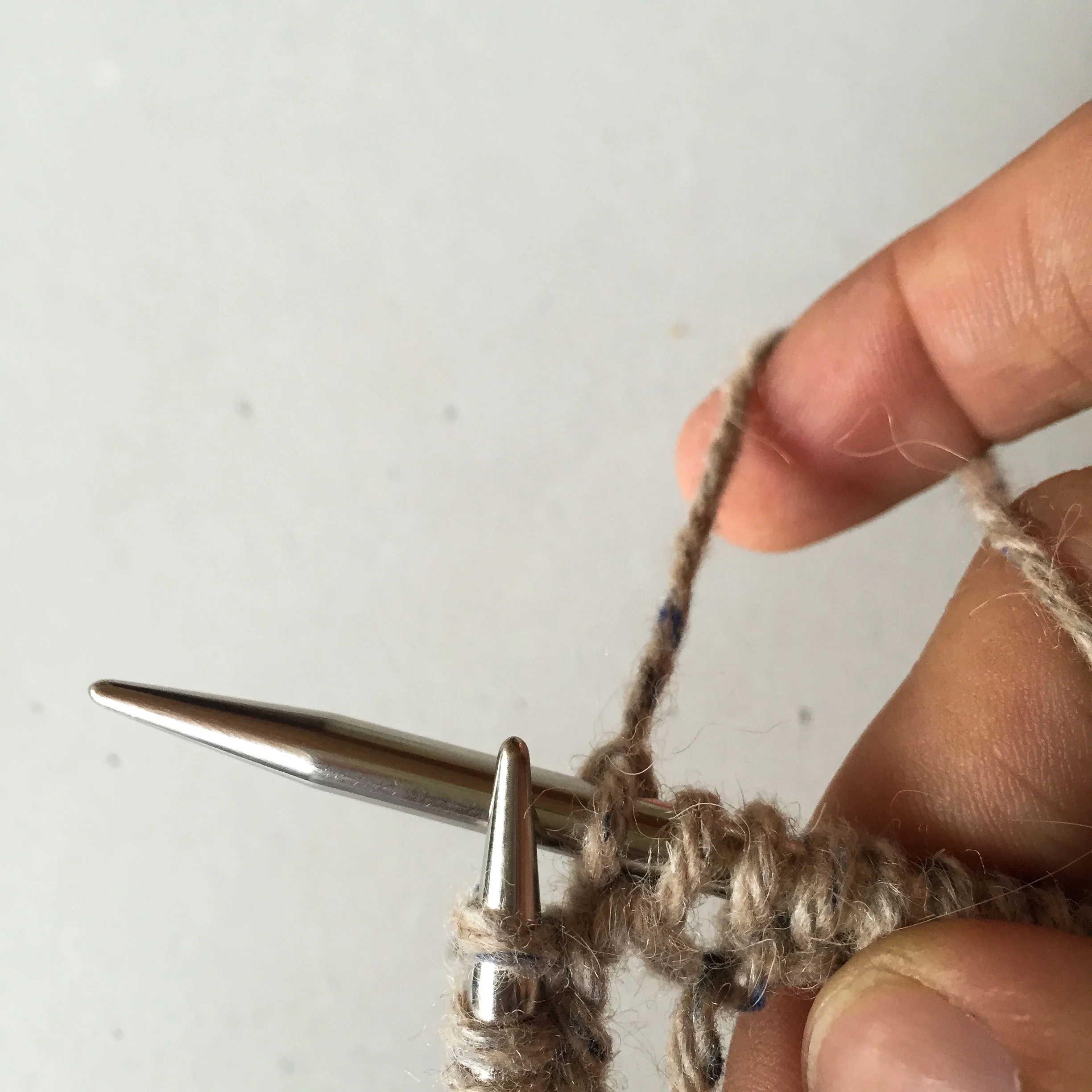 After the stitch has been knit. The first stitch on the right hand needle is your first knit stitch and what we call the beginning of the round. The second stitch on the right hand needle is the slipped stitch.
