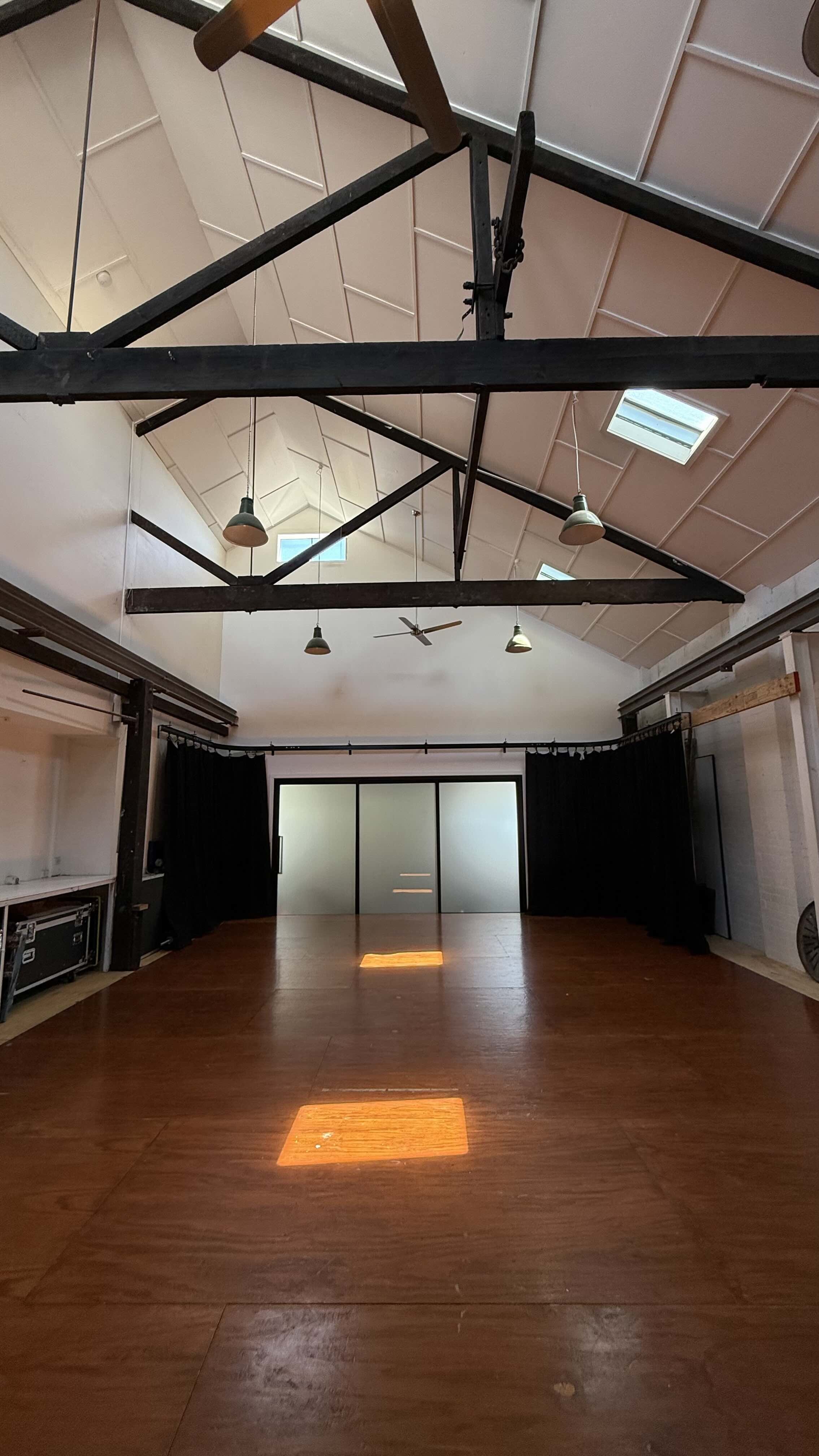 Large space looking towards 
front door with carpet stowed 