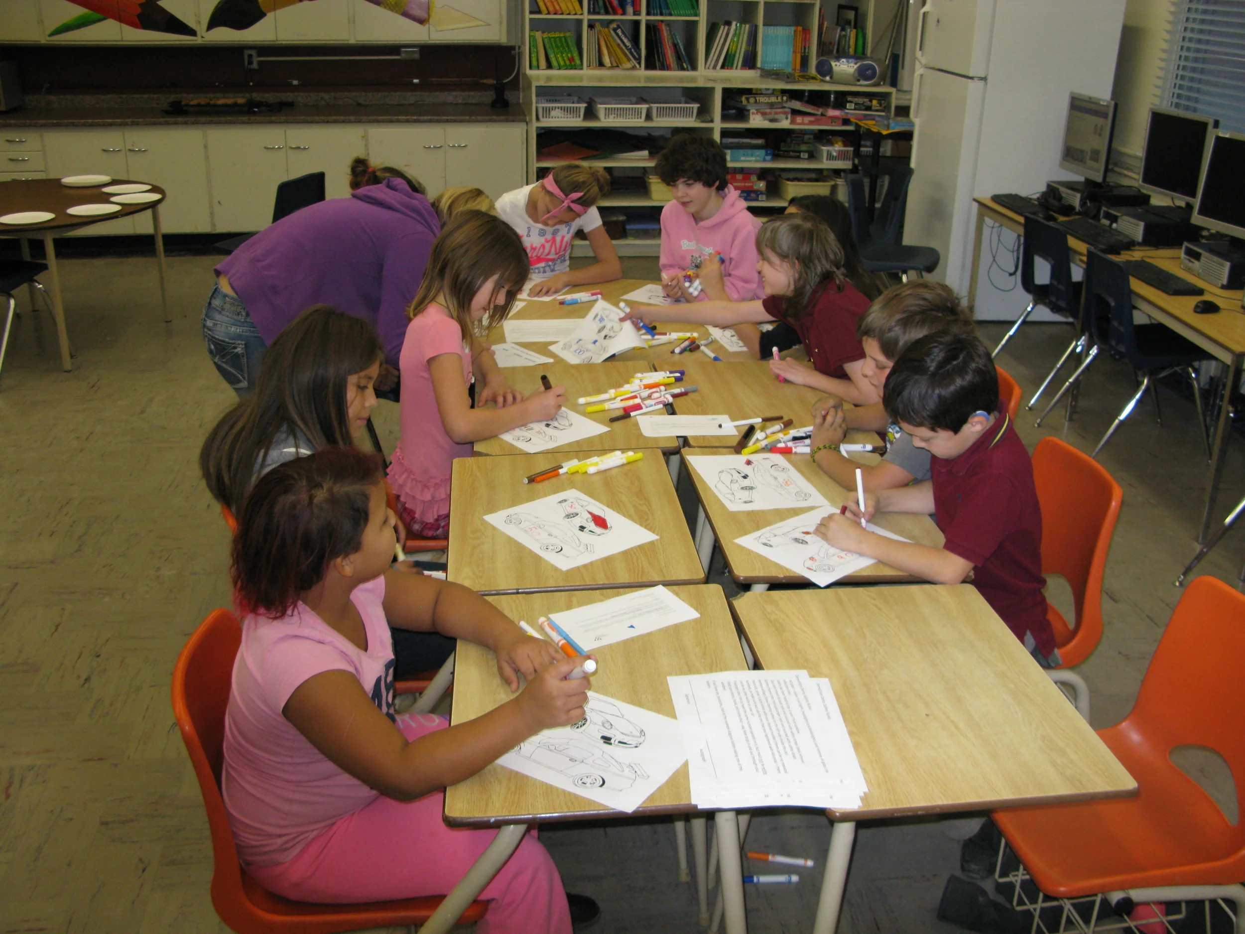 The kids colouring their cars!