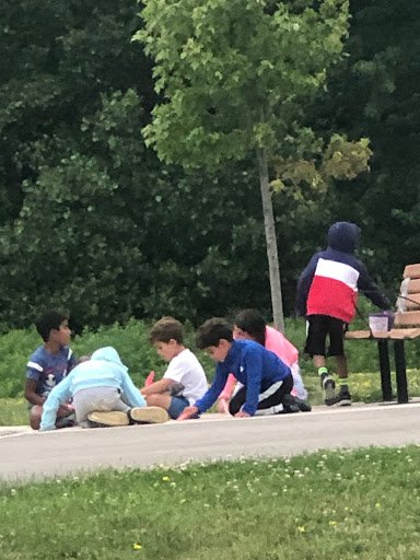 group of kids drawing in park.jpeg