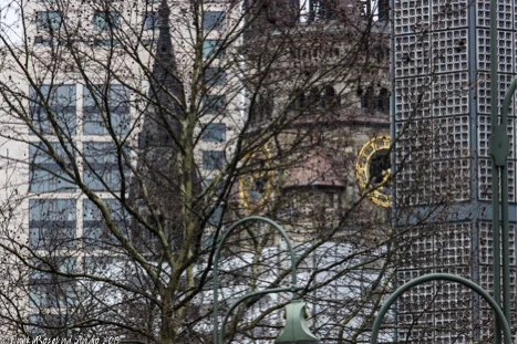 The centre tower is the original church, at the front is the new campanile- not sure about the spire! 