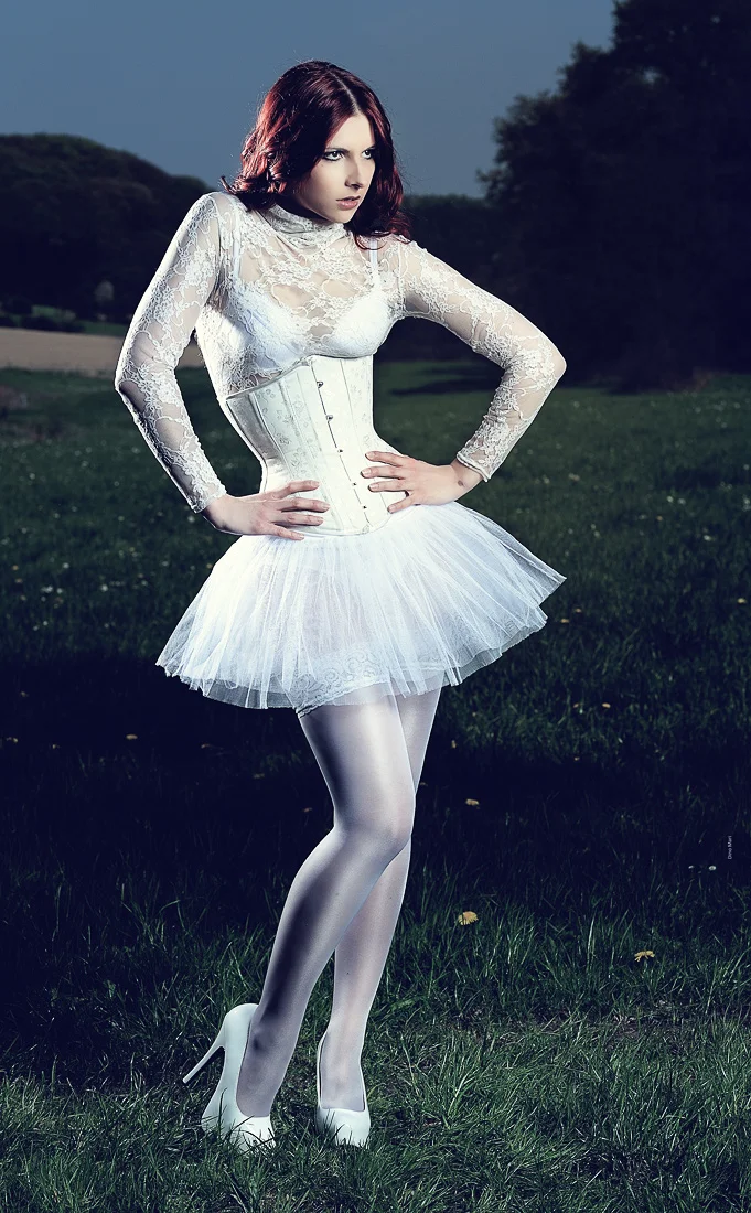 Slightly lower power on the quadra, a bit less darkened background. 2nd strobe firing from behind her. Just *because*. 