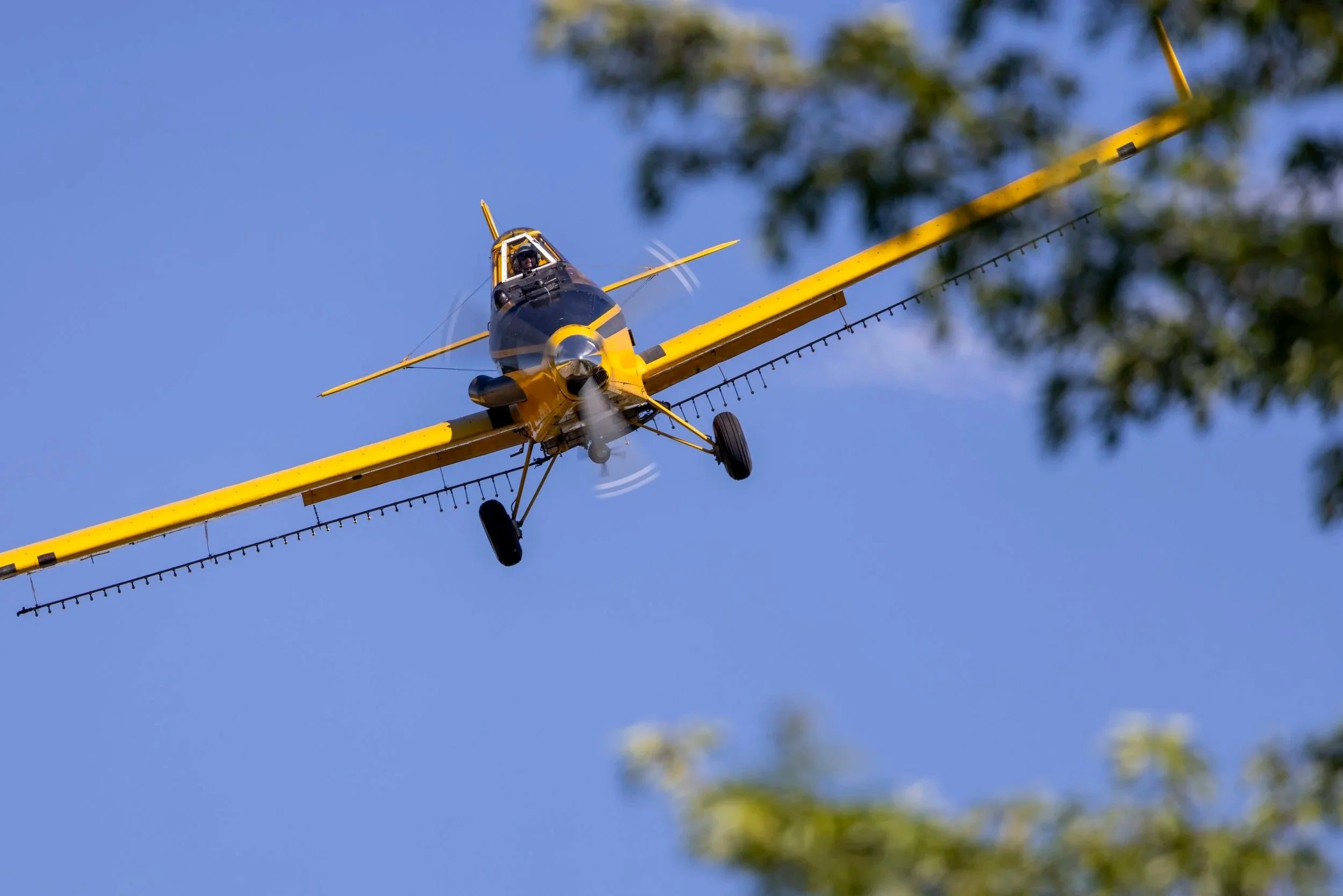 Valley Air agricultural spray plane making an aerial application pass in Idaho