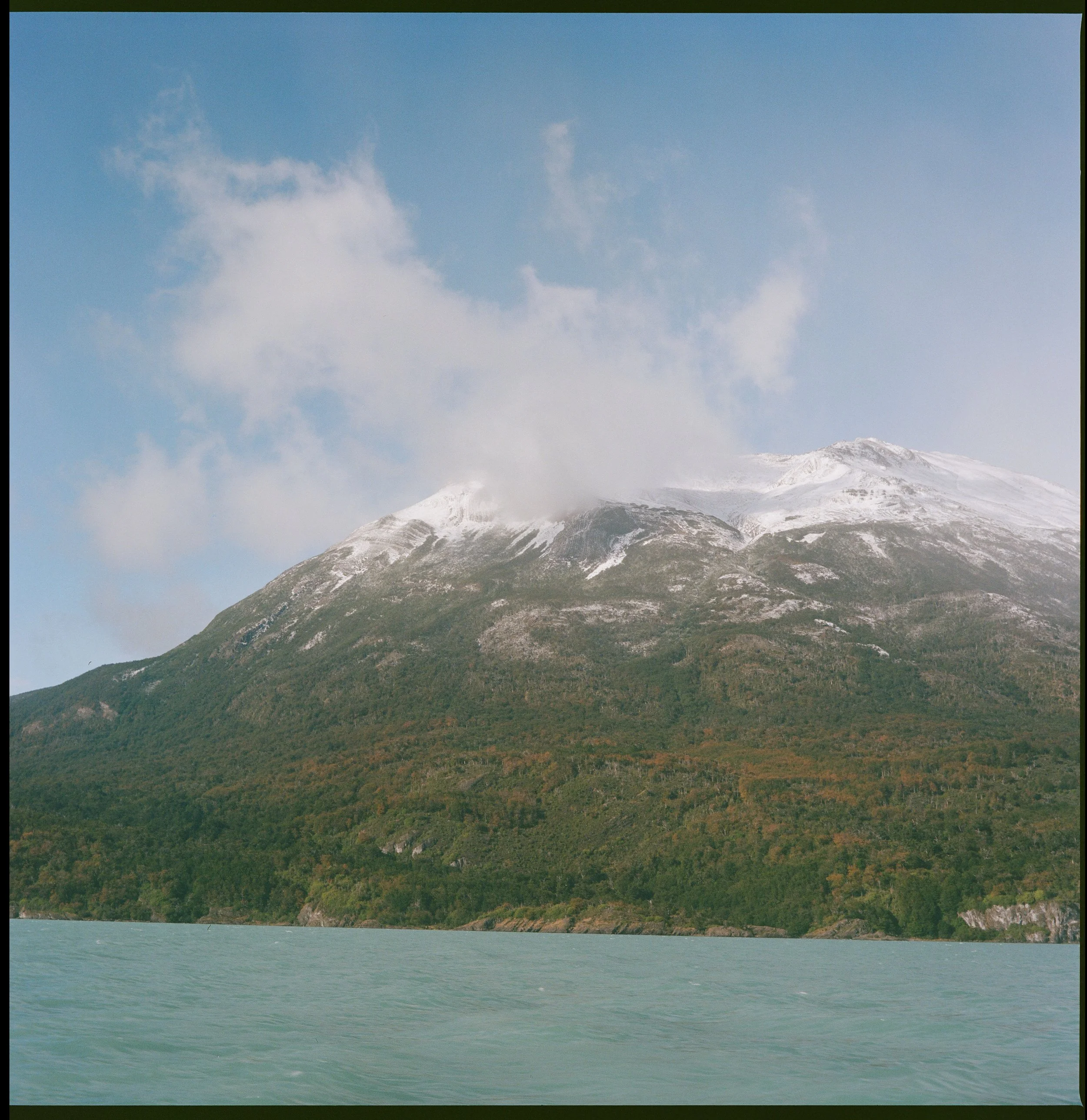 Dancing with a cloud and orange trees  (Lago Argentina, Los Glaciares National Park)