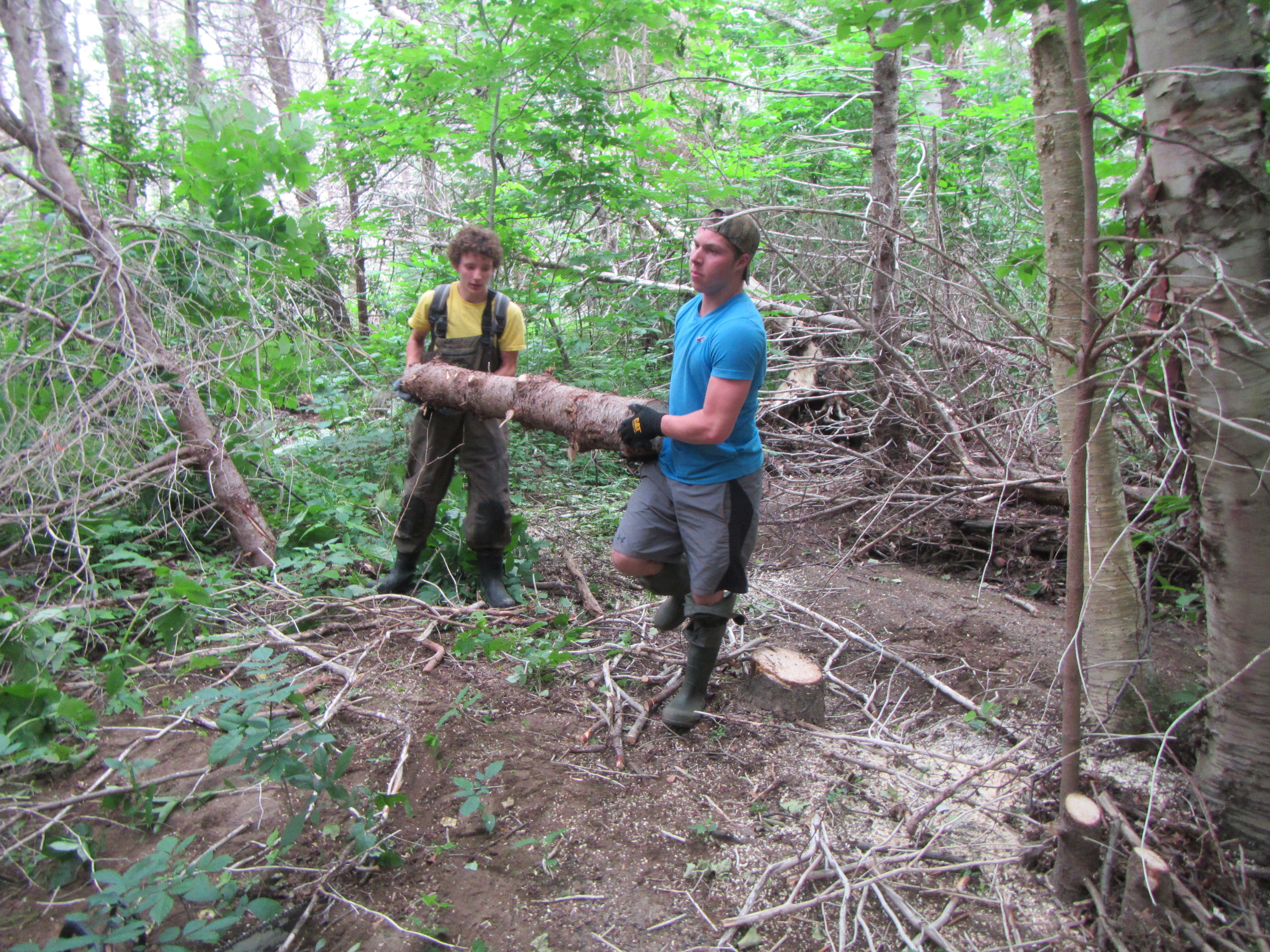 Antoine Aucoin and Logan Lapierre removing debris. 
