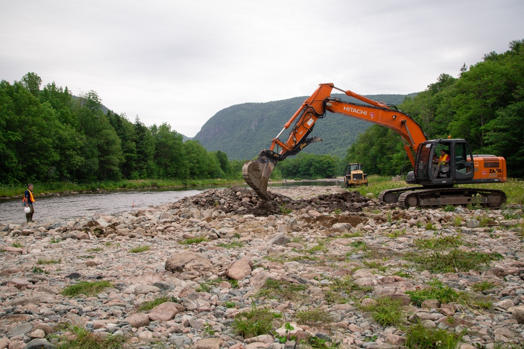 Charles MacInnis overseeing installation of rock retarding bars.