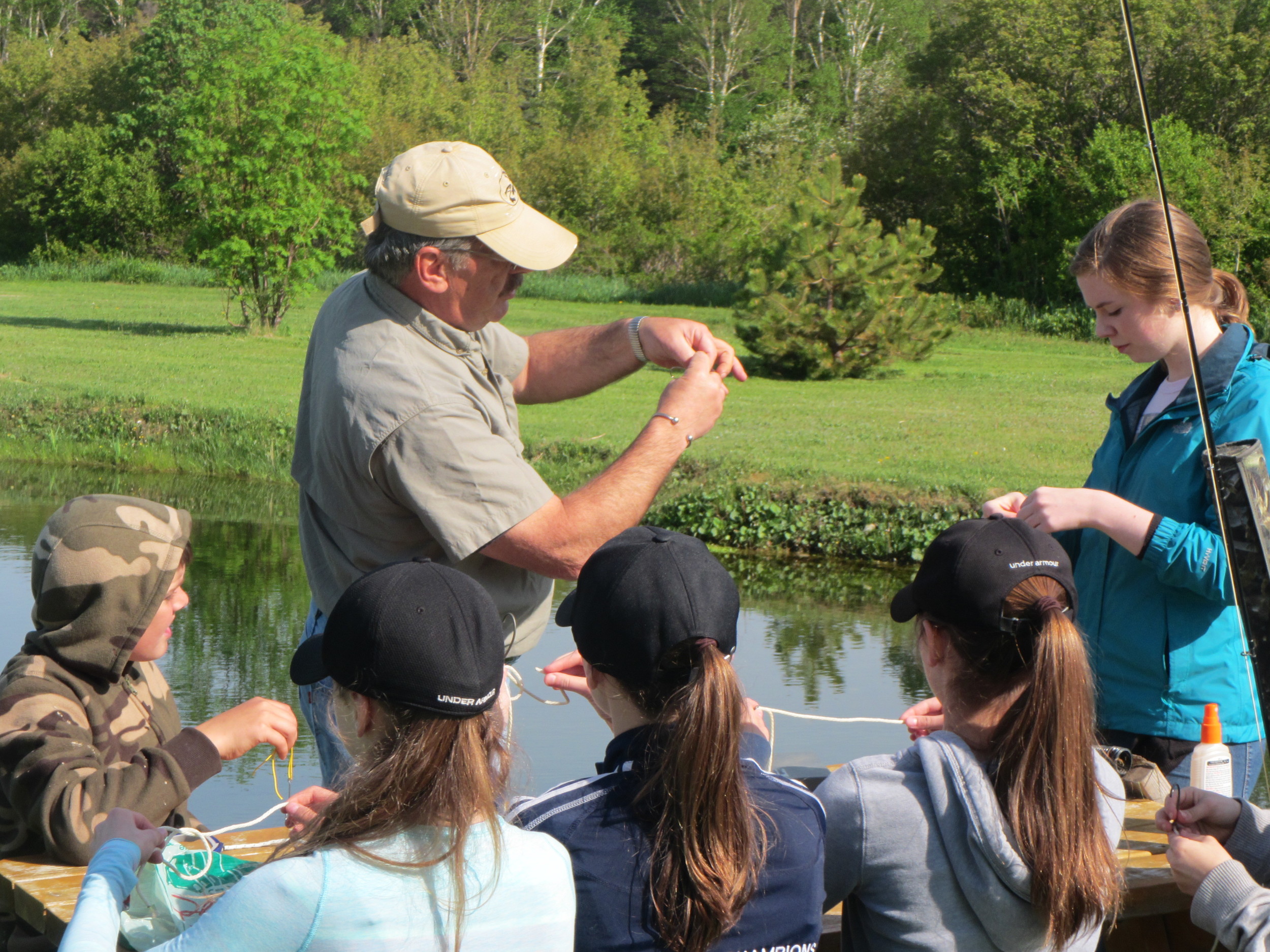 John shows the grade 7 class how to tie some simple fly knots.