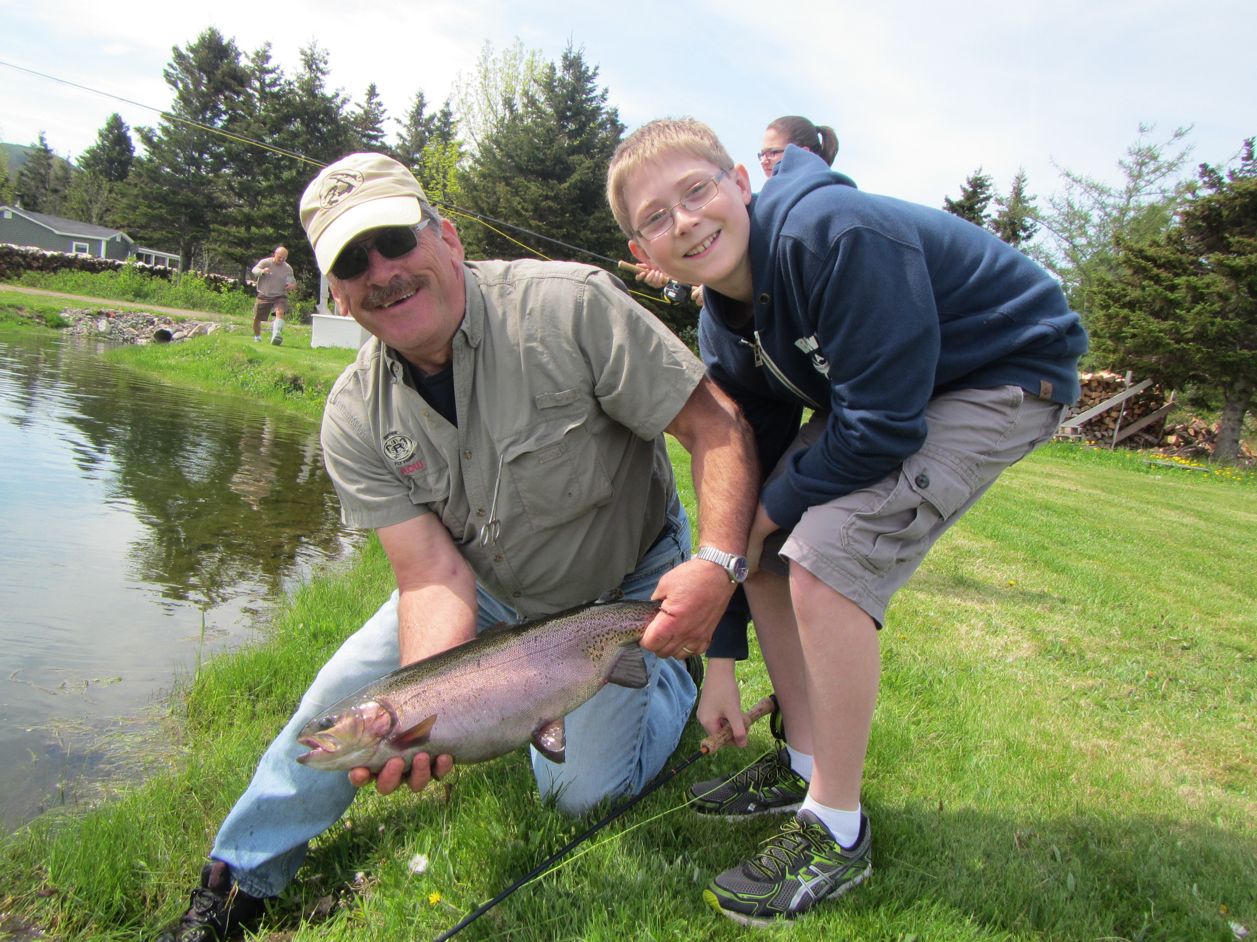 John poses with one of the grade 7's with his big catch!