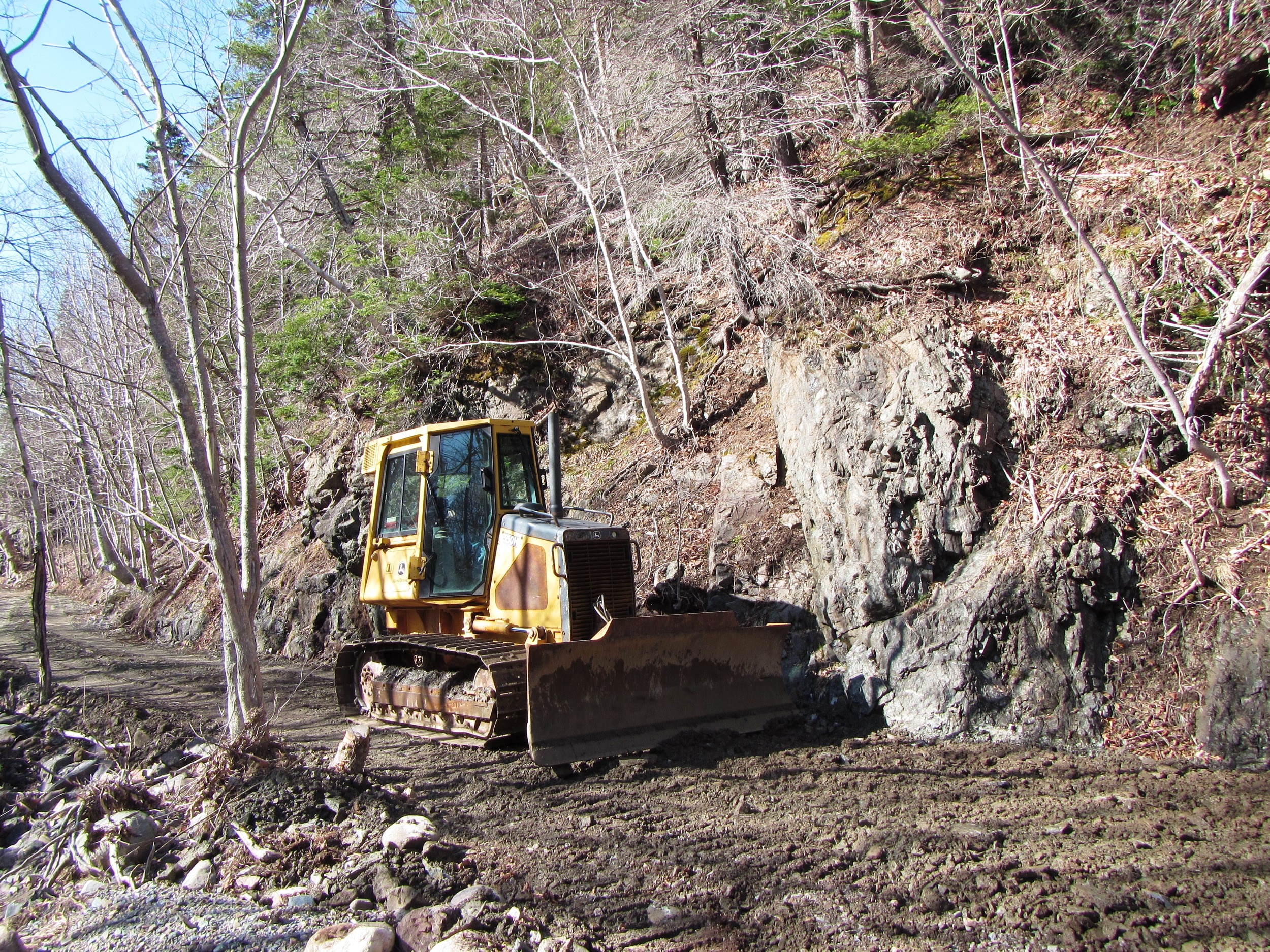 Bulldozer working to smooth the surface on the Salmon Pools trail