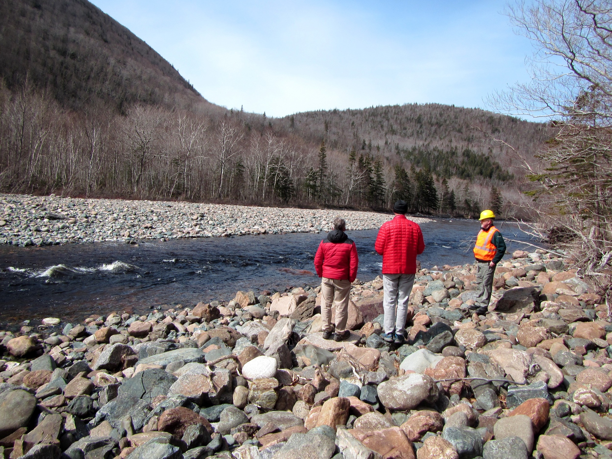 Part of the habitat restoration team (from left, Rene Aucoin, President of the CRSA, Lewis Hinks, Director of Programs for NS with the Atlantic Salmon Federation, and Archie Doucette, with Parks Canada) looking at the work completed at Fence Pool last year, and discussing plans for Phase III work