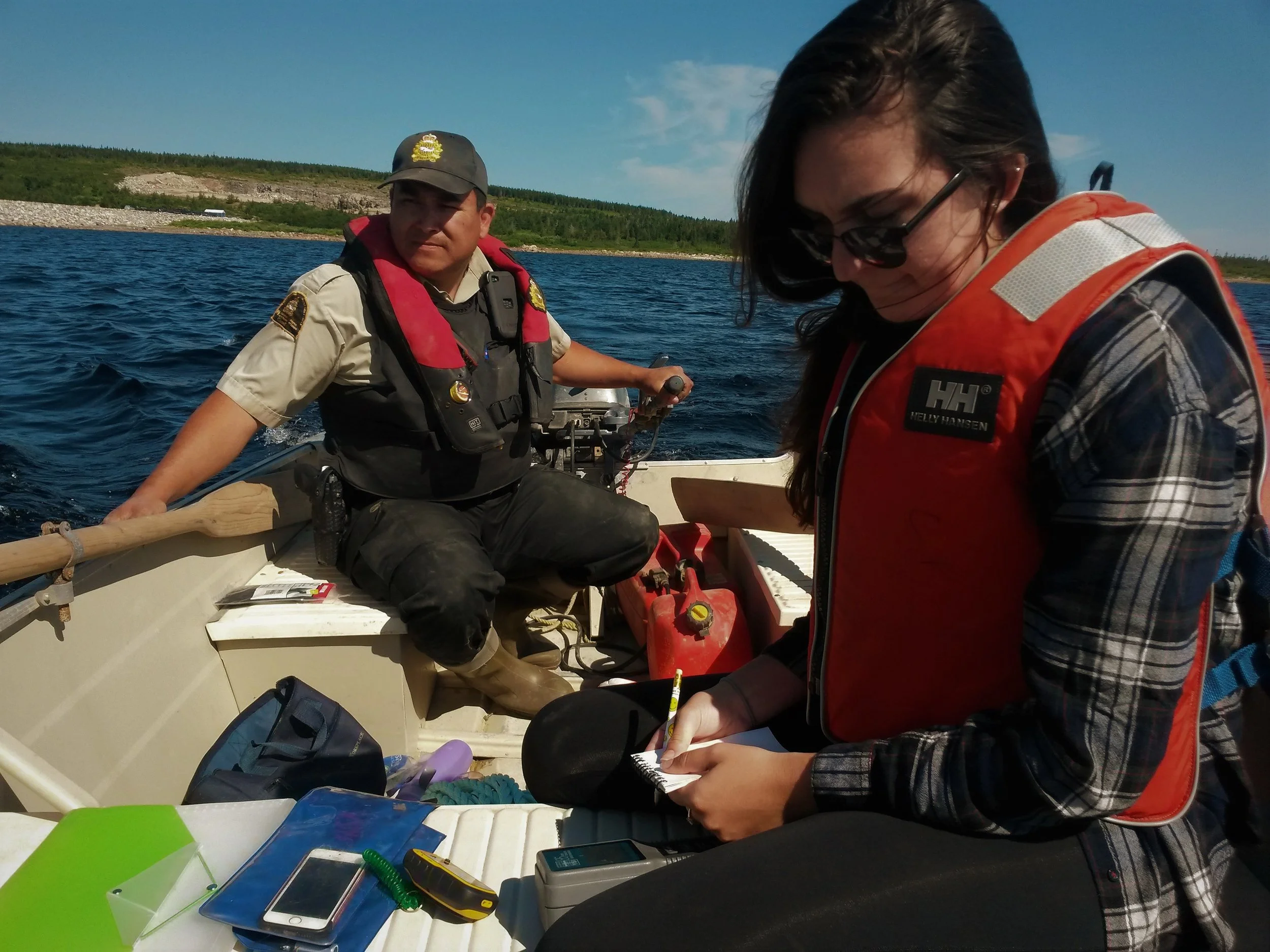Last year's Field Technician, Gabrielle McLaughlin, recording water temperature data on a trip to the Cheticamp reservoir.