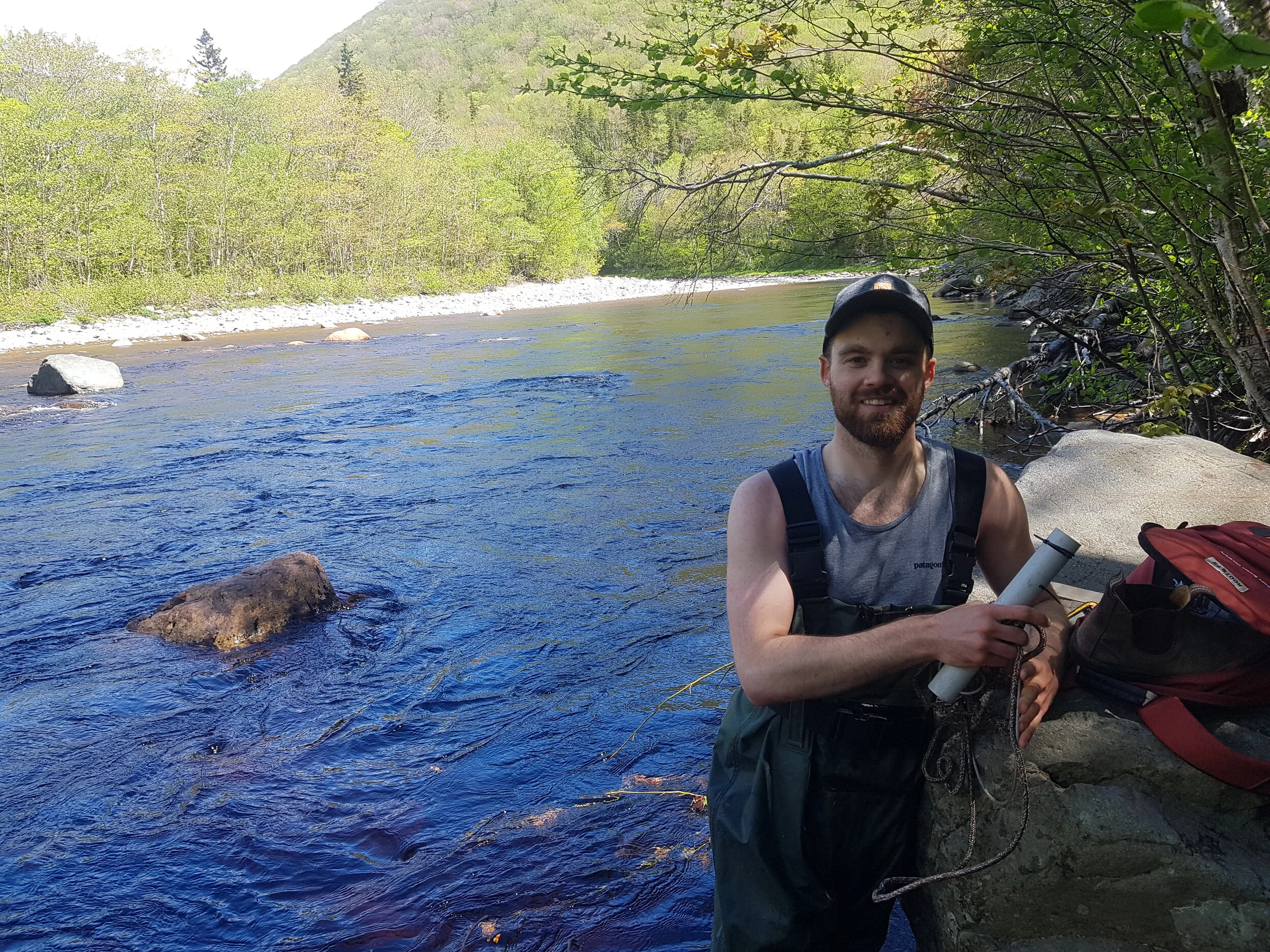 Matt Fraser, CRSA’s Habitat Restoration Crew Leader this summer, helped install water temperature loggers on the Cheticamp River