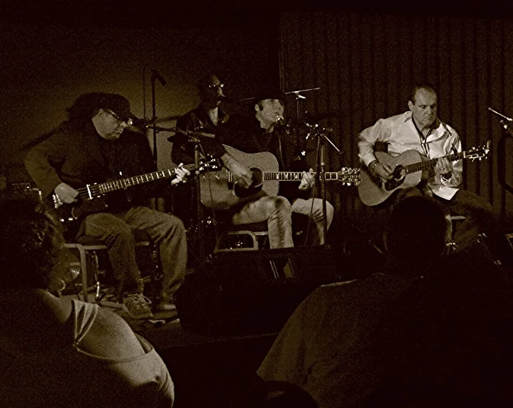 Mario on stage with 'Impromptu & Unrehearsed'