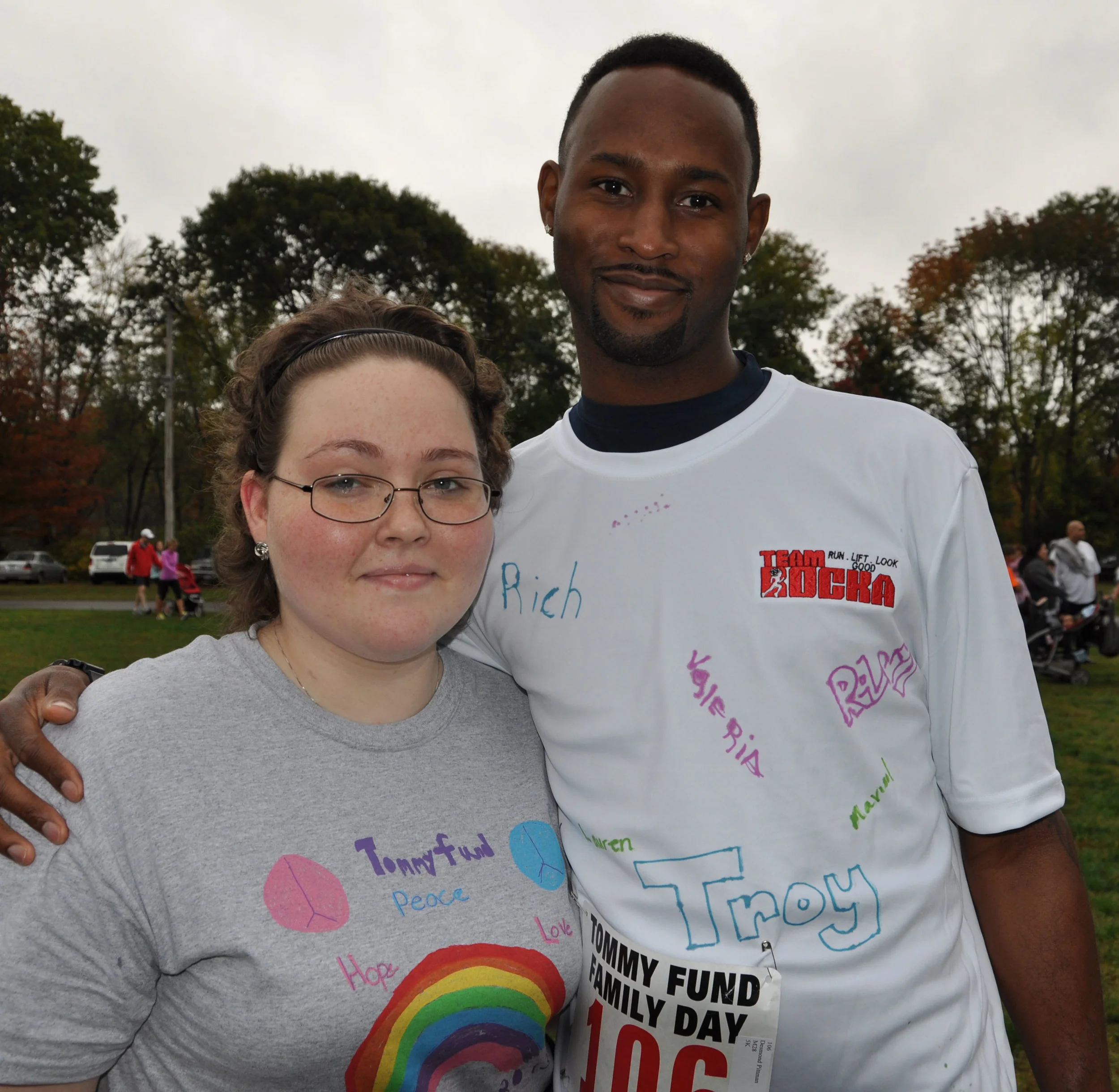 Desmond Pittman, an EVS worker at Smilow, chats with Elyce Madden of Ansonia before the start of the Family Day 5K road race. 
